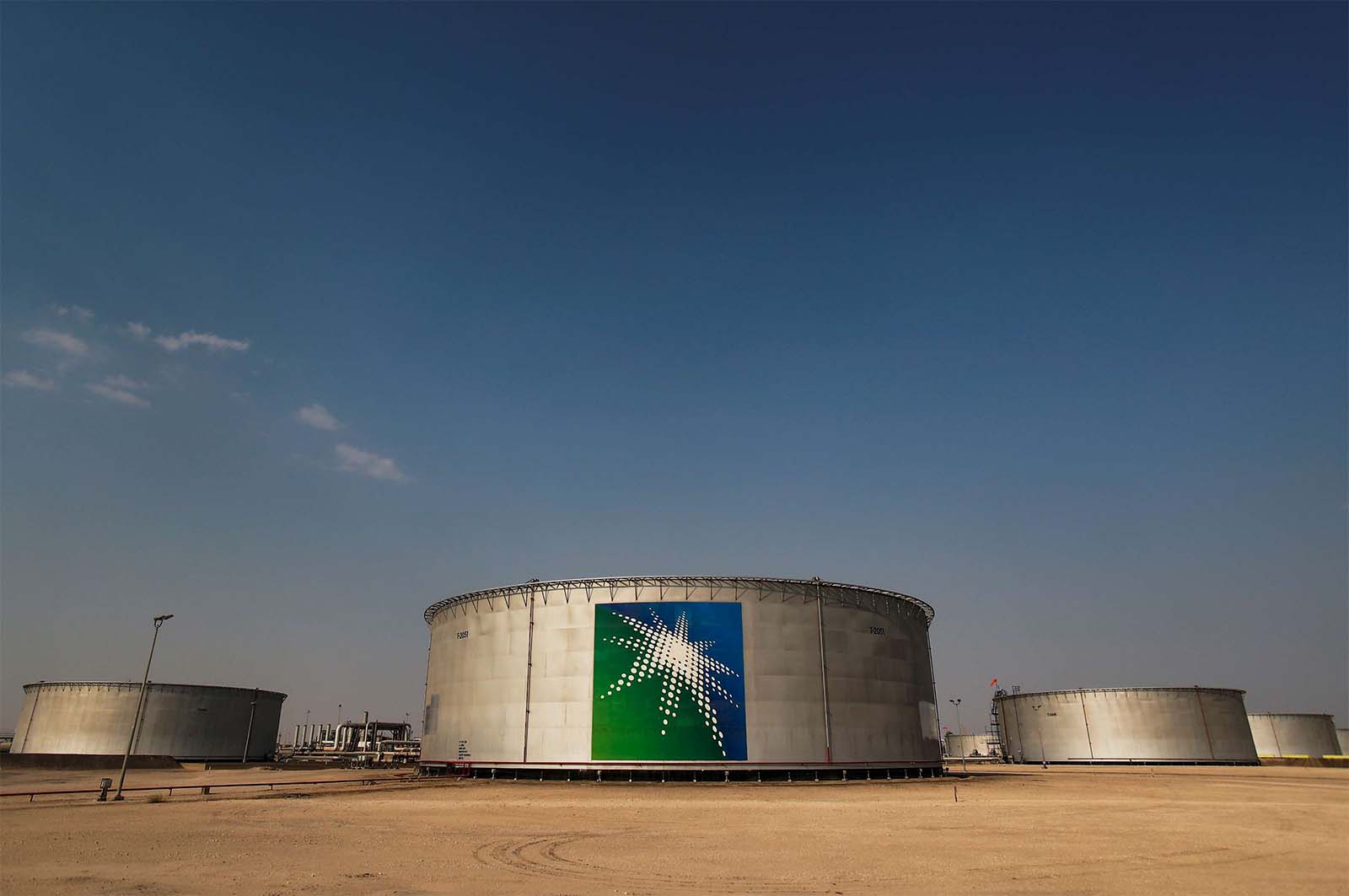 Branded oil tanks at Saudi Aramco oil facility in Abqaiq, Saudi Arabia