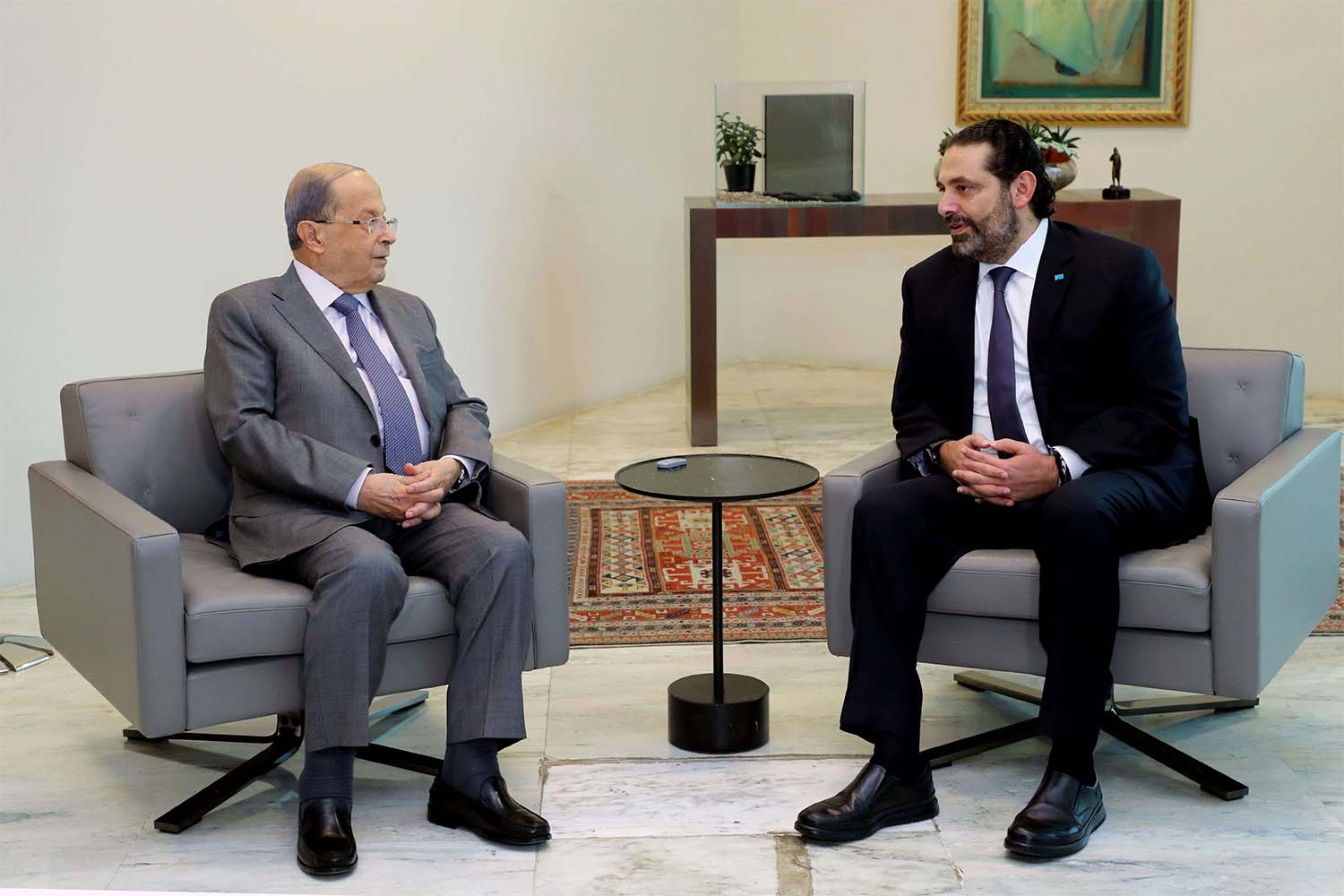 President Michel Aoun (L) meeting with caretaker prime minister Saad Hariri at Baabda presidential palace