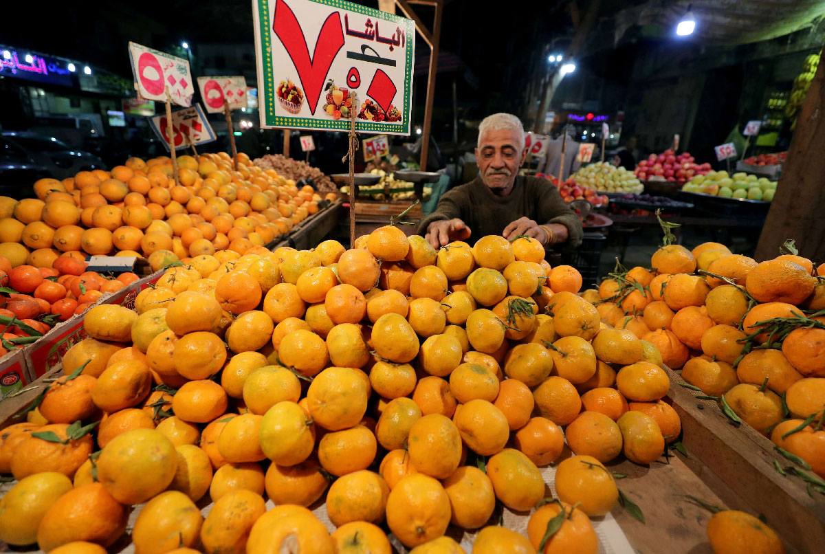 An Egyptian fruit seller is seen at a market in Cairo