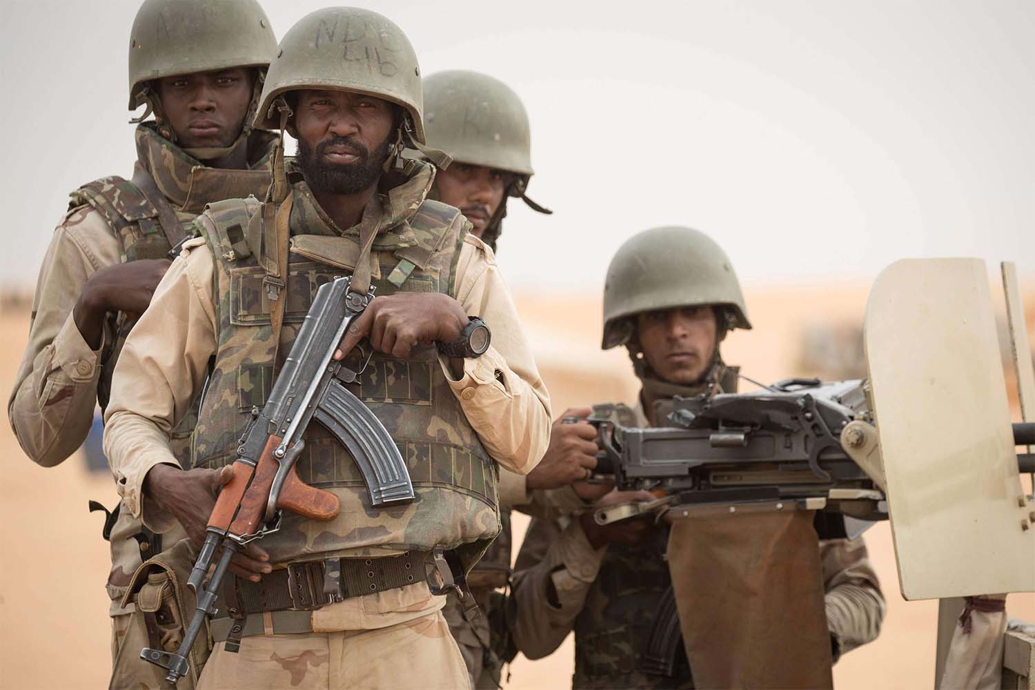 Mauritanian soldiers stand guard at a G5 Sahel task force command post