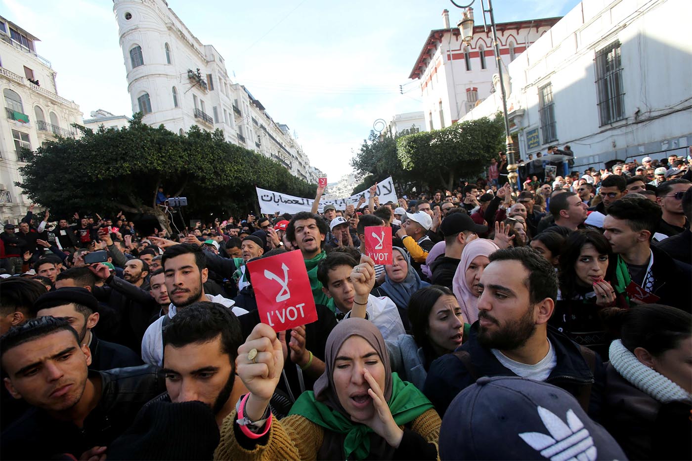 Demonstrators shout slogans during a protest calling to reject the upcoming presidential election in Algiers