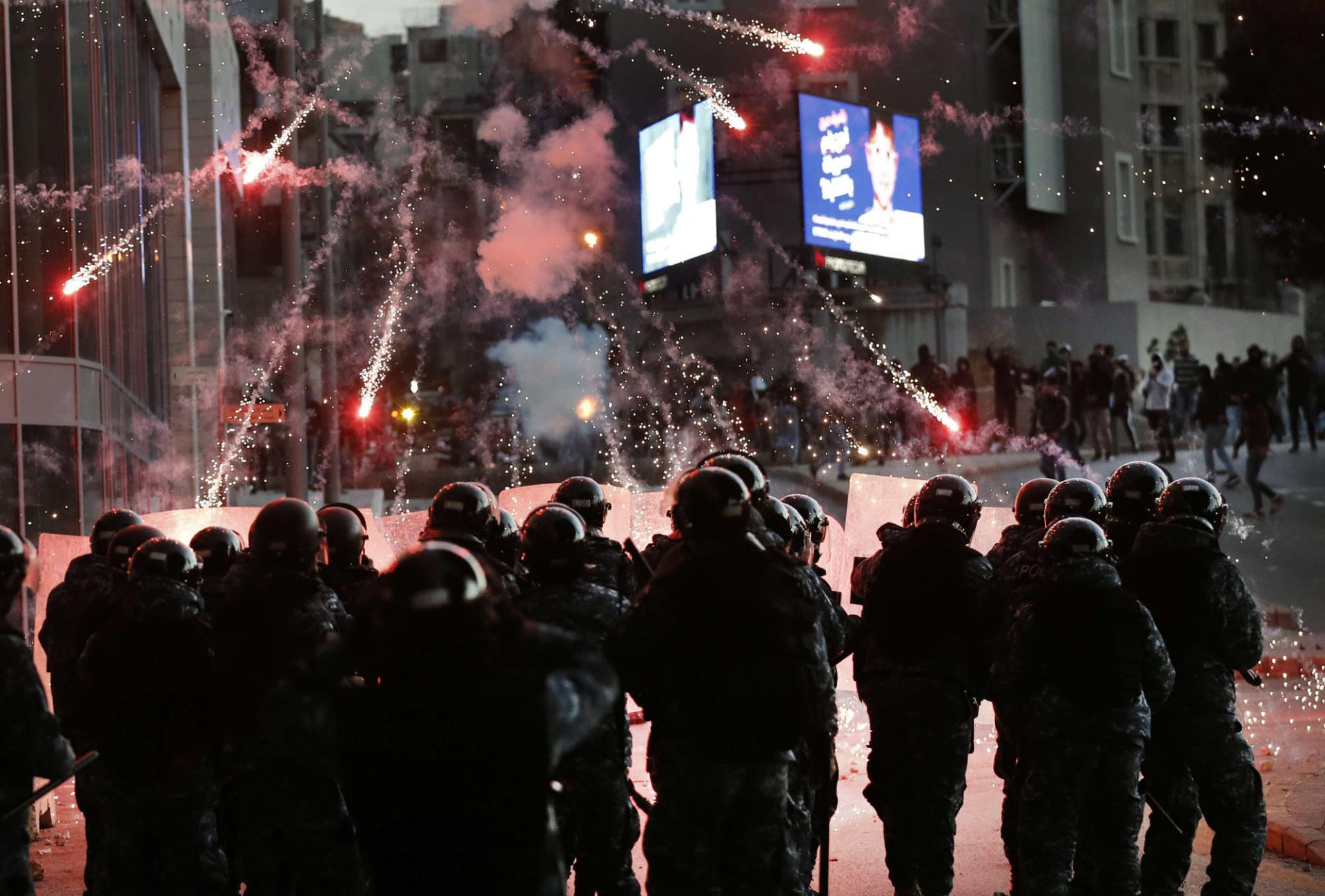 Anti-riot police intervened, firing teargas to disperse them.