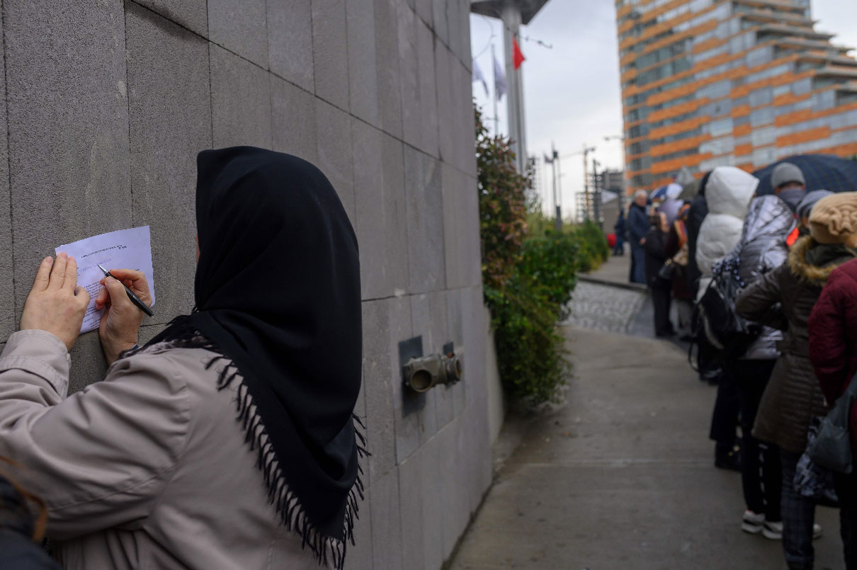 People wait in line to submit their petitions opposing a massive canal project at Atasehir, in Istanbul