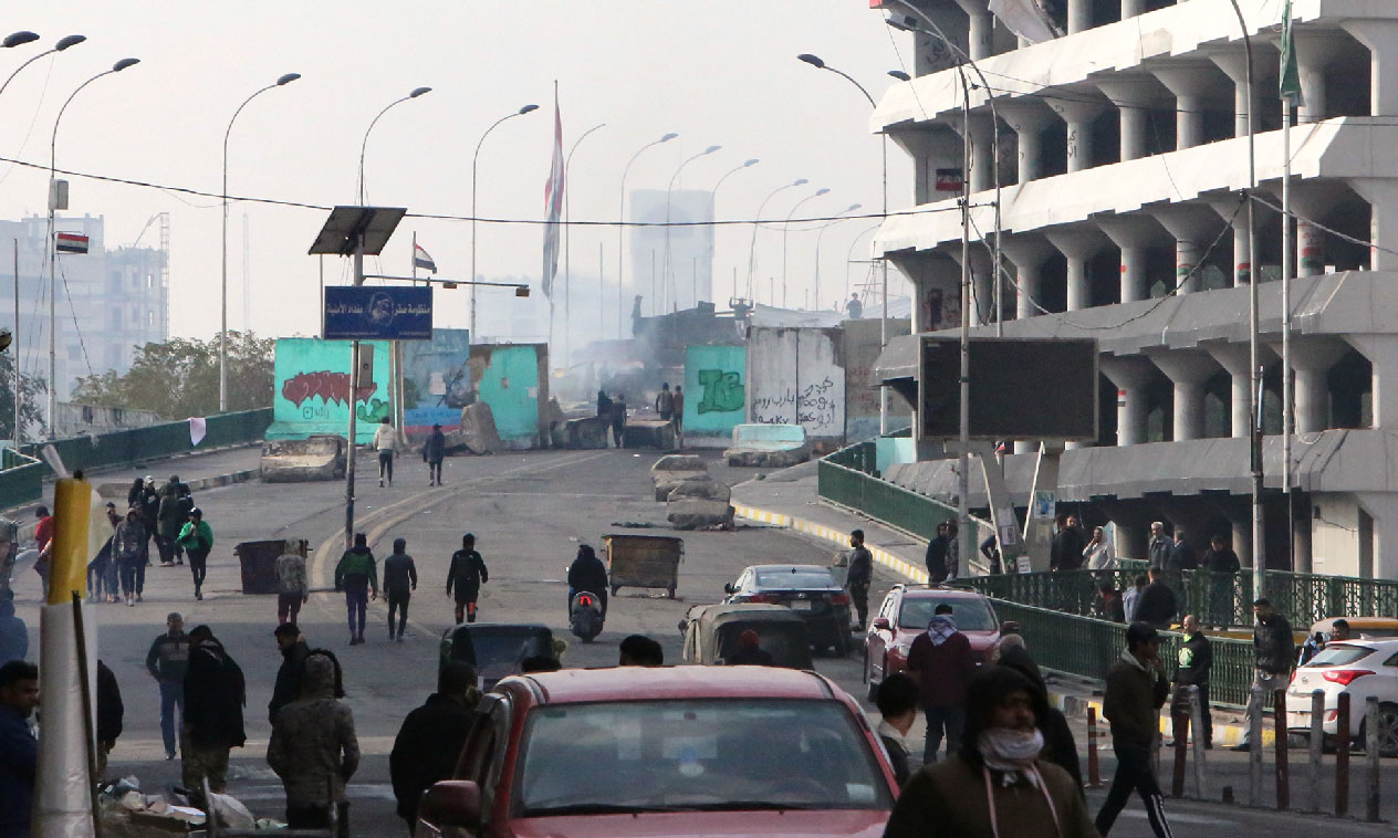 Iraqi anti-government protesters gather at al-Sinek bridge in the capital Baghdad