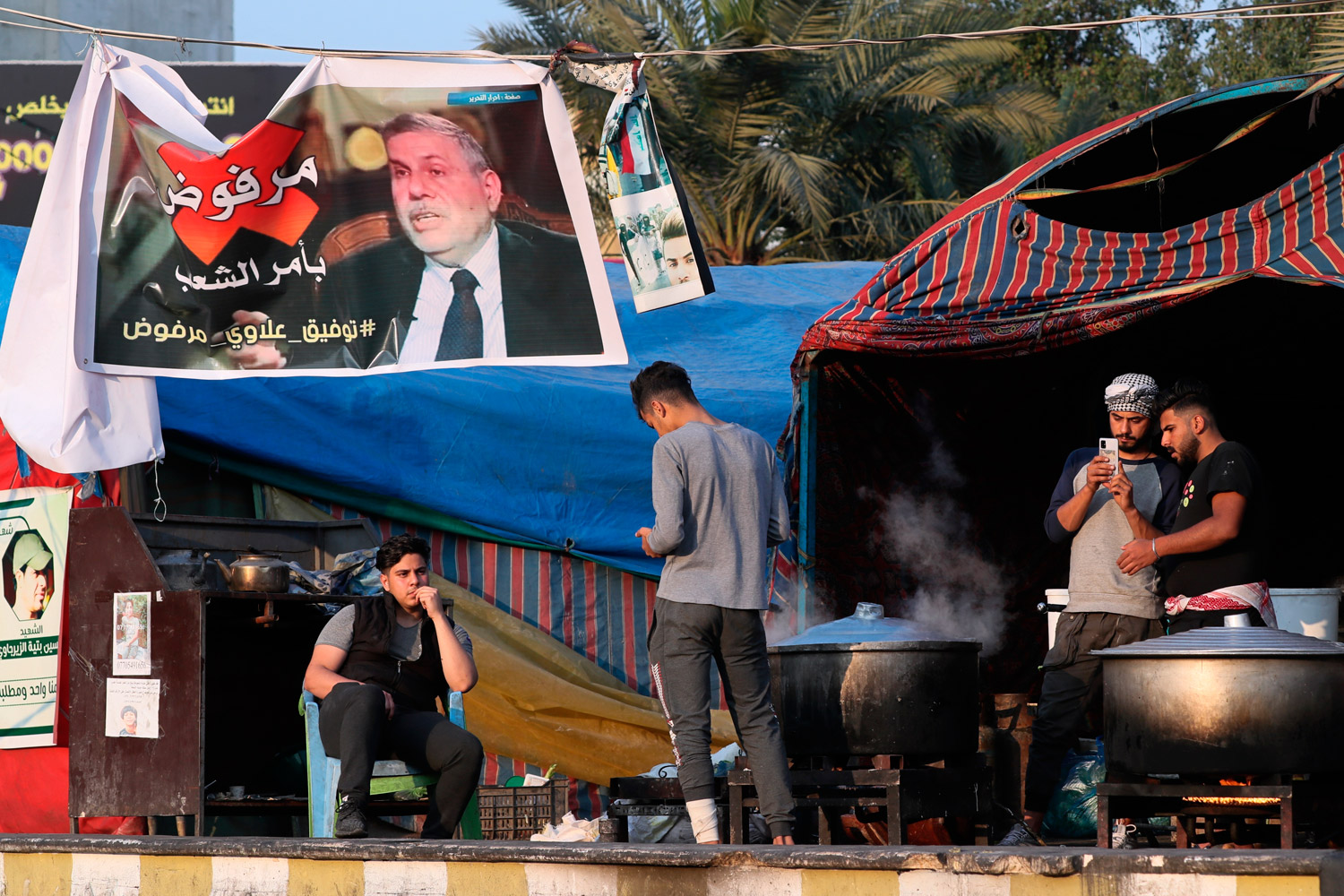 توافق بين المتظاهرين على رفض علاوي على خلاف السياسيين