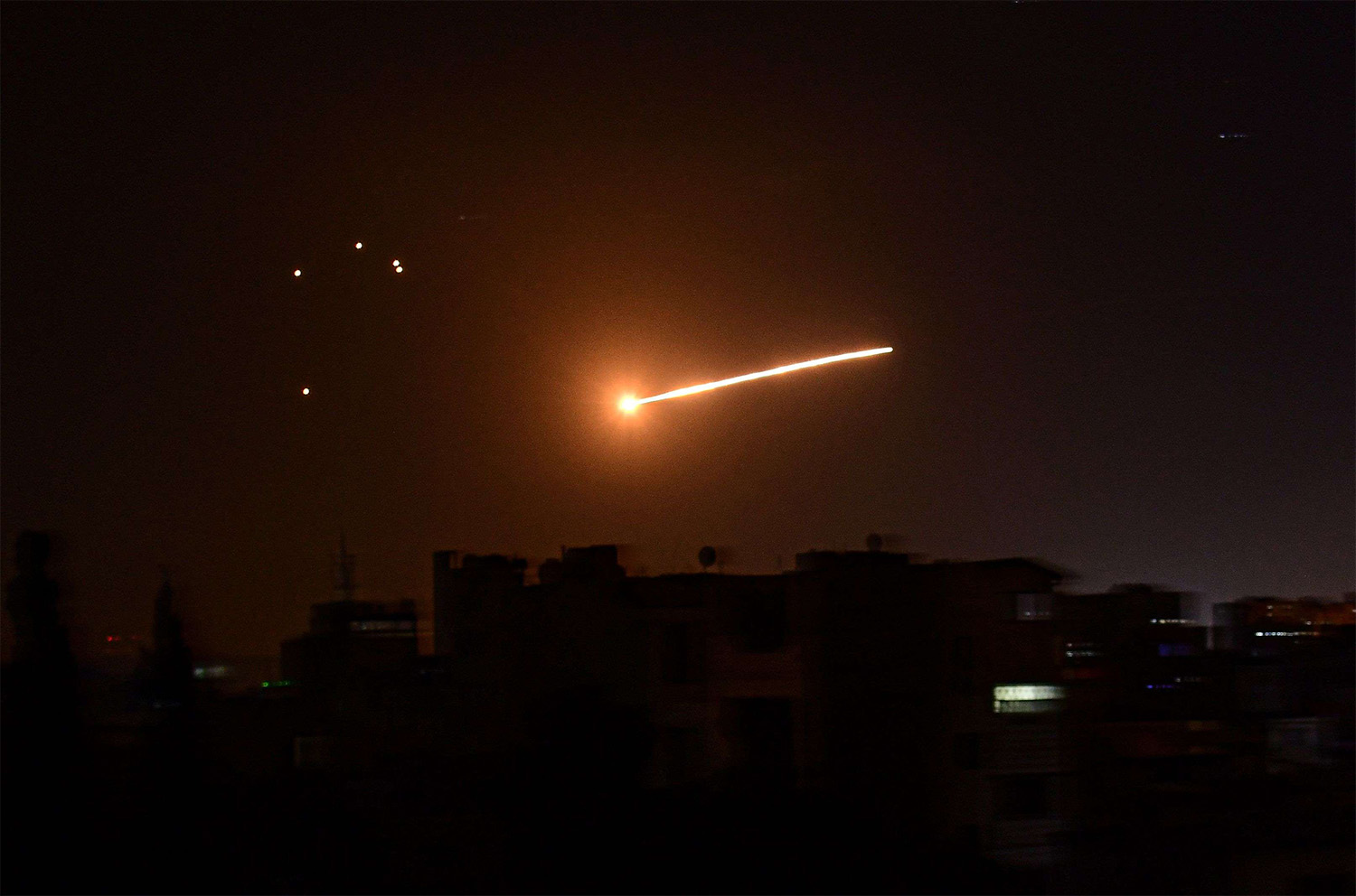Syrian air defence intercepting an Israeli missile in the sky over the Syrian capital Damascus