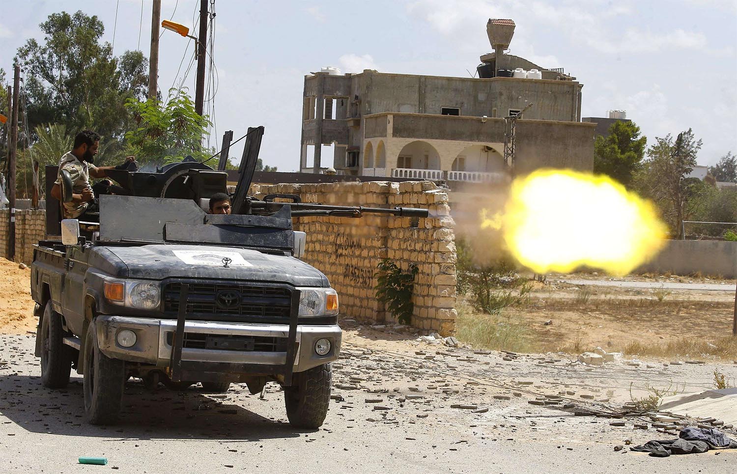 Fighter loyal to GNA fires a truck-mounted gun