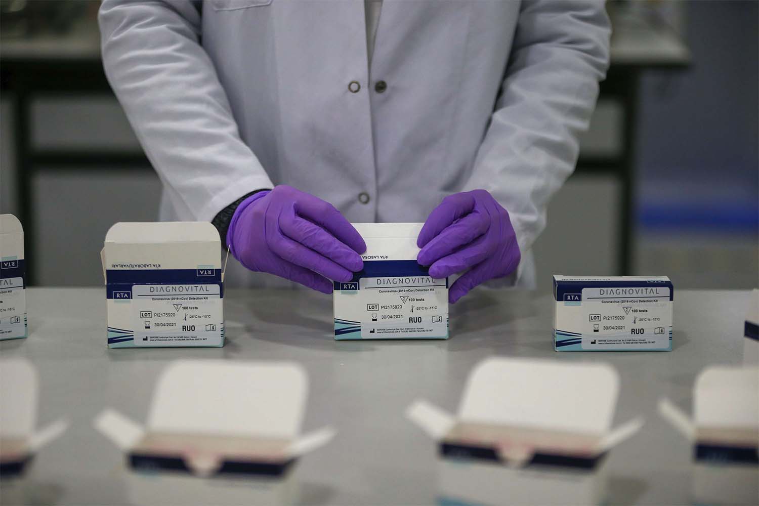 A research and development company worker works on the production of coronavirus testing kits in Gebze, northwestern Turkey