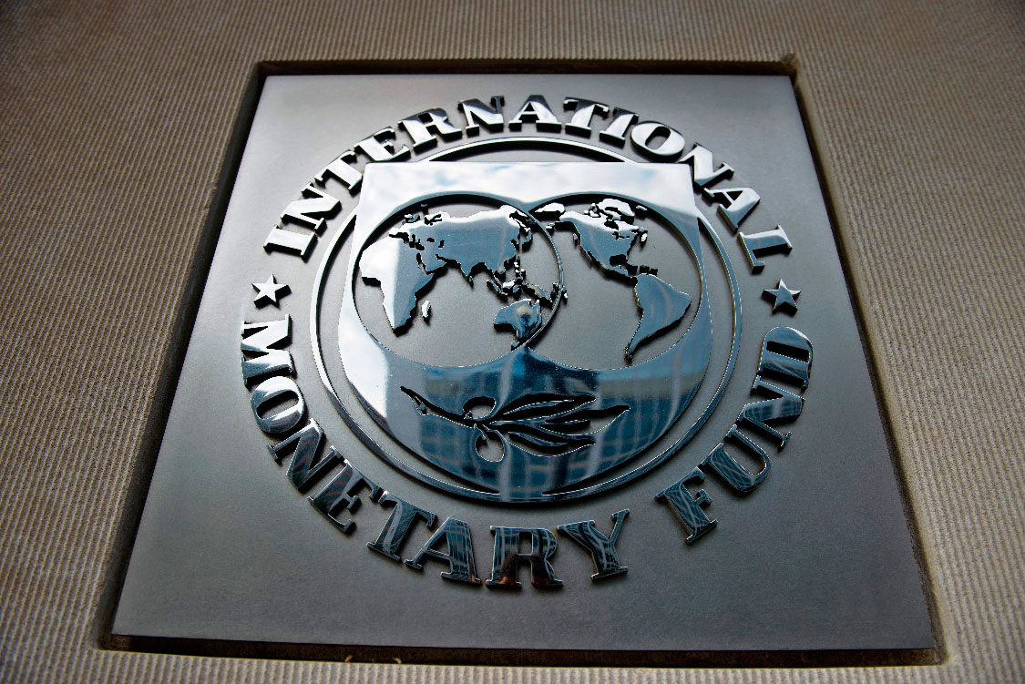 A logo is seen outside the headquarters of the International Monetary Fund in Washington