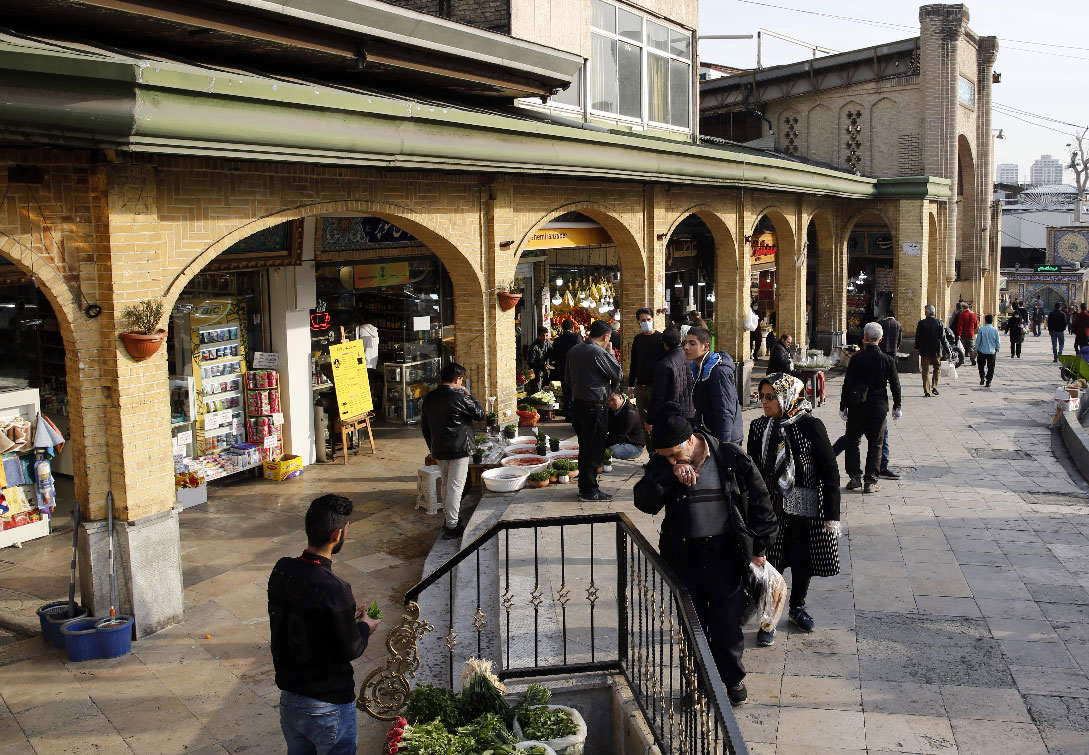 People view items for sale outside the Tajrish Bazaar in Iran's capital Tehran