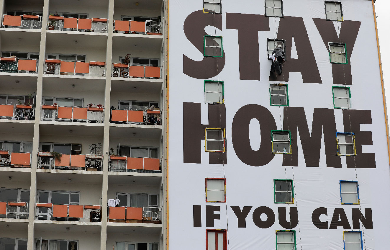 A billboard is installed on an apartment building in Cape Town, South Africa
