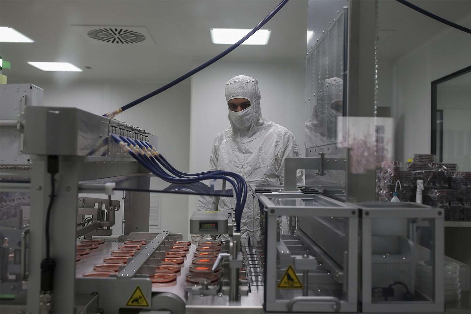 A worker oversees the production of coronavirus testing kits in Gebze, northwestern Turkey,
