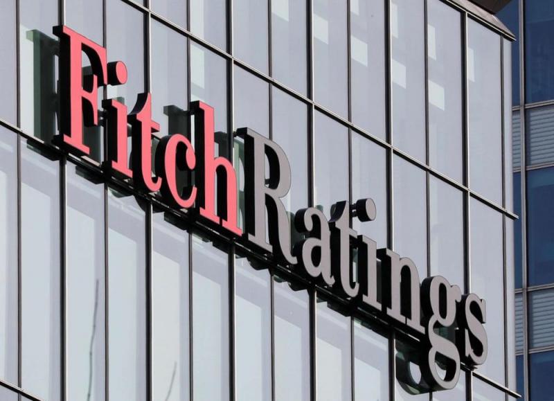 The Fitch Ratings logo is seen at their offices at Canary Wharf financial district in London