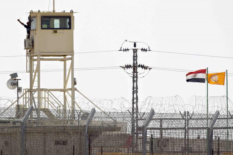 A member of Egypt’s security forces stands on a watchtower in the northern Sinai peninsula, as seen from the Israeli side of the border