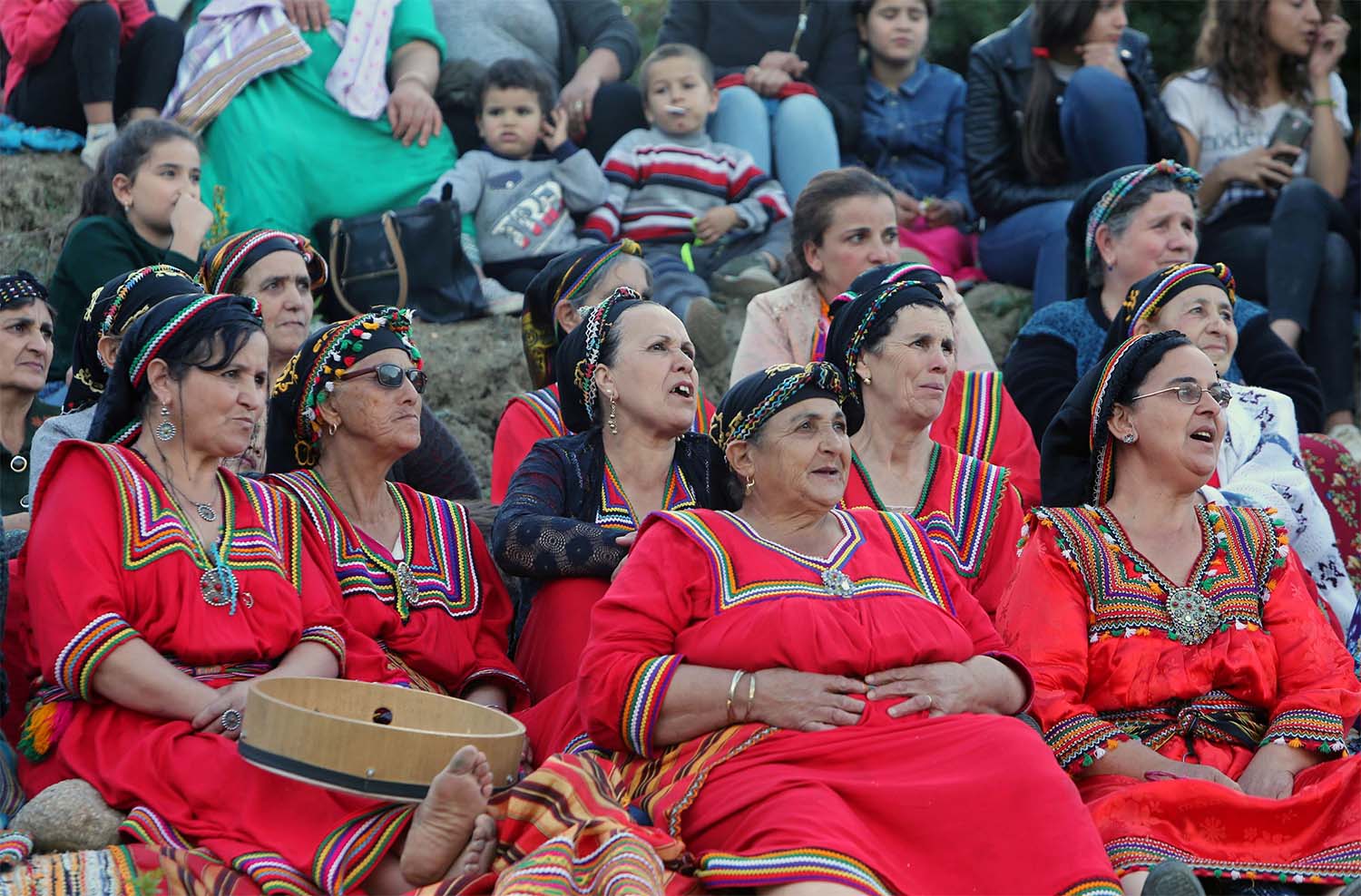 Women spectators watch a match in an annual local soccer tournament played by an all women teams, at the village of Sahel