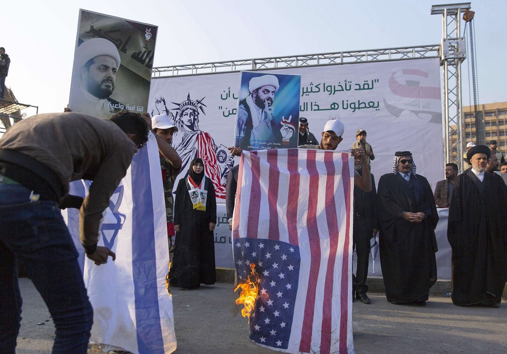 أذرع إيران تلوح بالعنف للدفع نحو إخراج القوات الأميركية من العراق