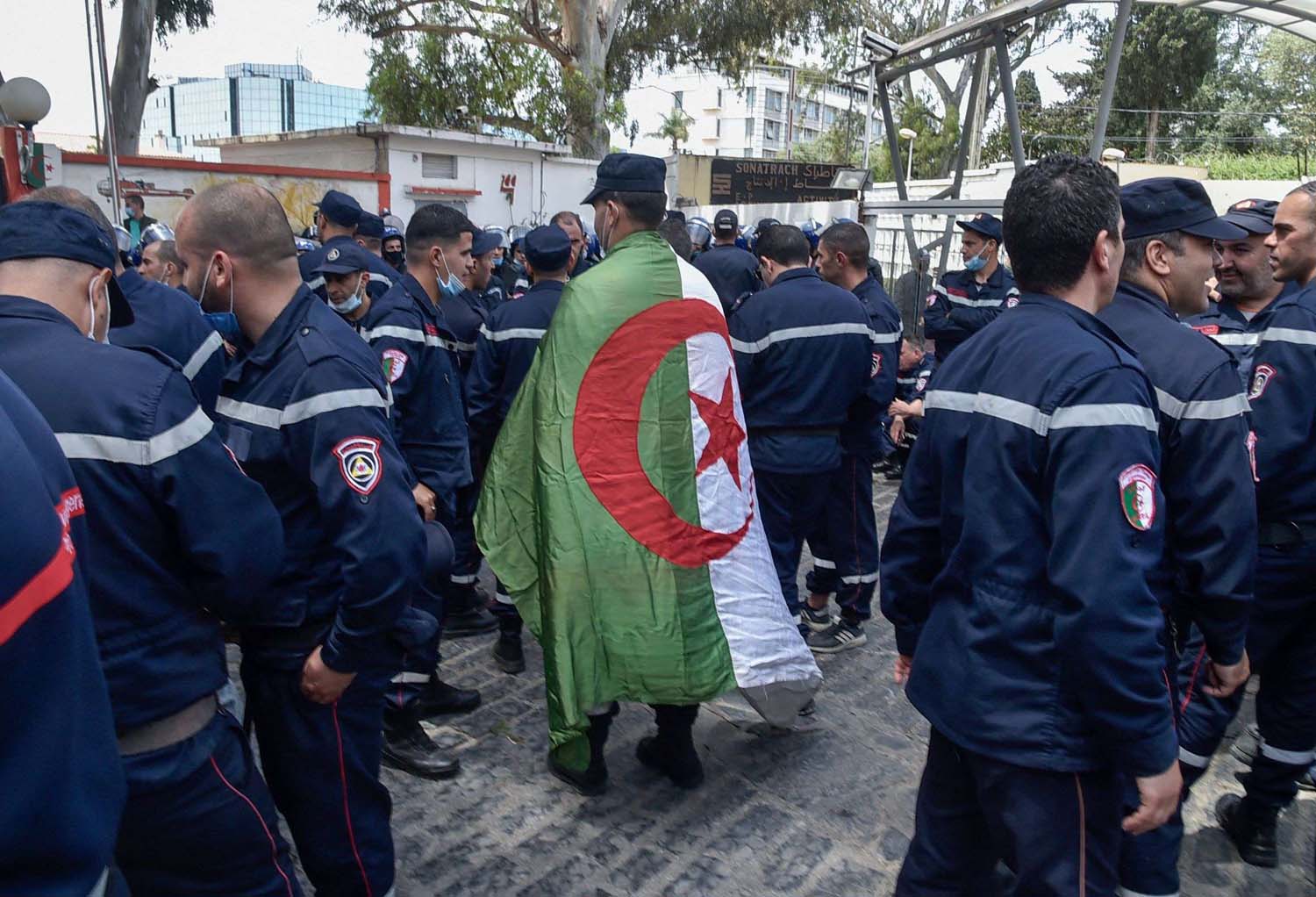 Firefighters and other civil protection personnel marched in uniform 