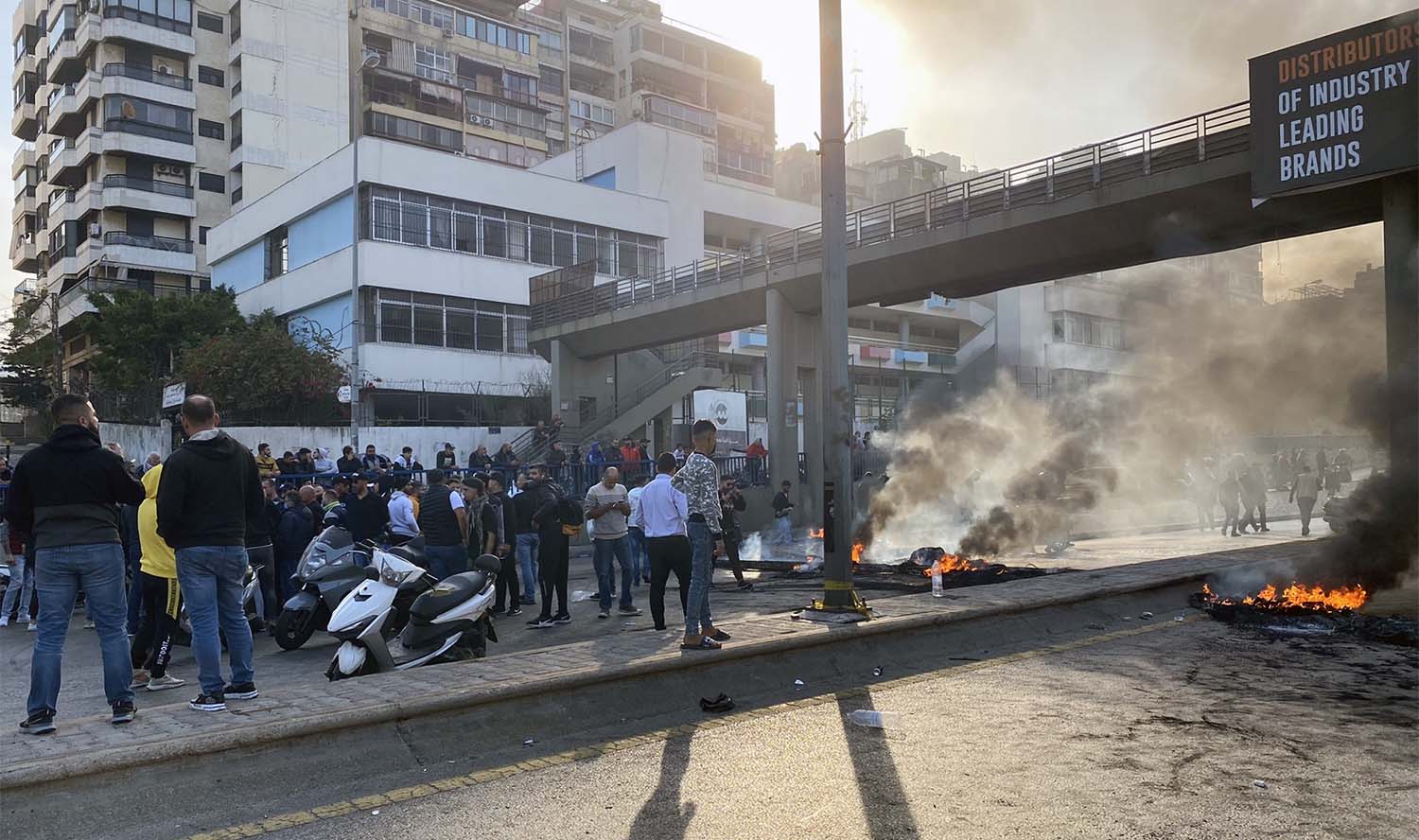 Roads were blocked by burning tyres in central Beirut, Tripoli and Sidon
