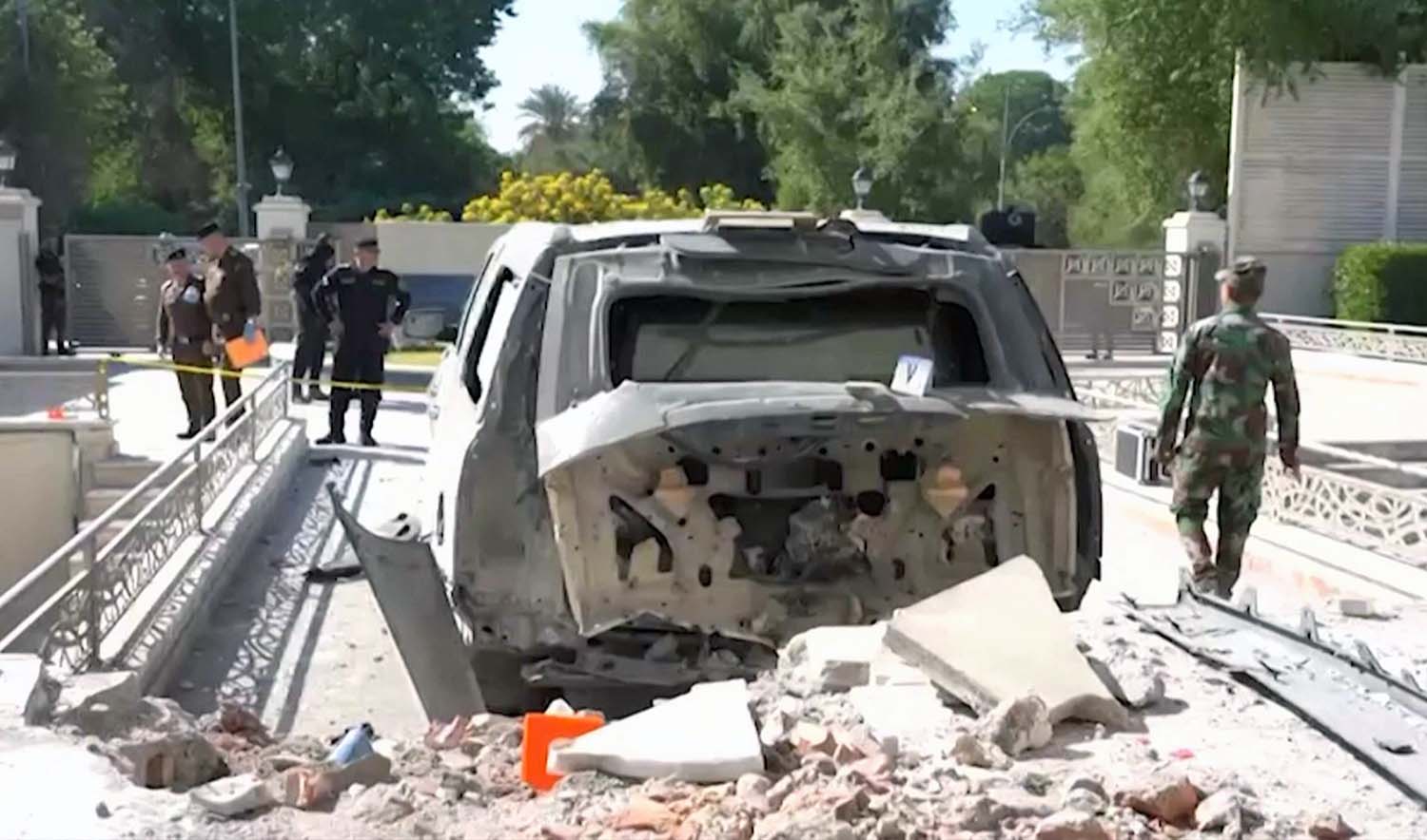 A damaged vehicle in the aftermath of a drone strike on Iraqi prime minister's residence