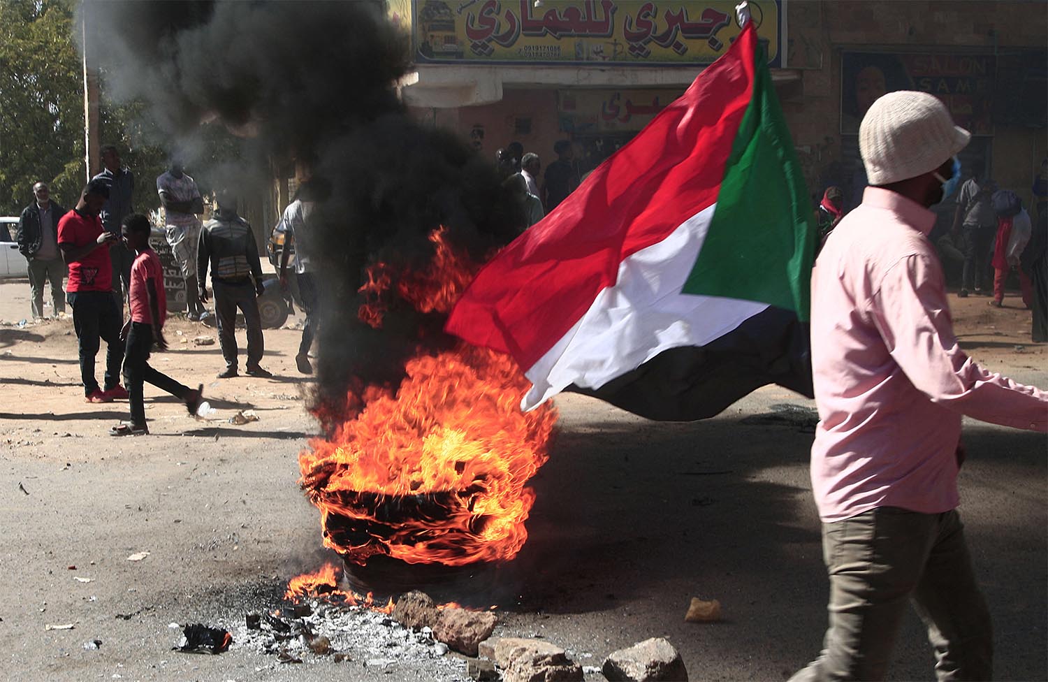 Protesters brave tear gas to demonstrate against military rule 
