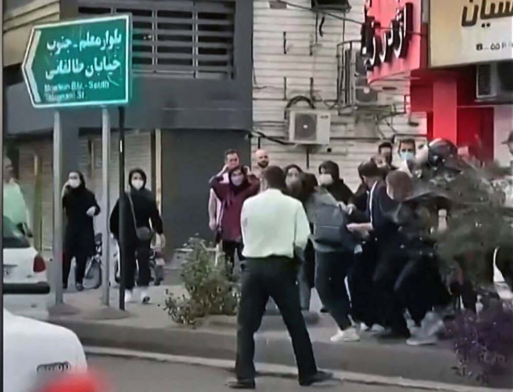 Female protesters are being roughly handled by Iranian security forces in the city of Rasht