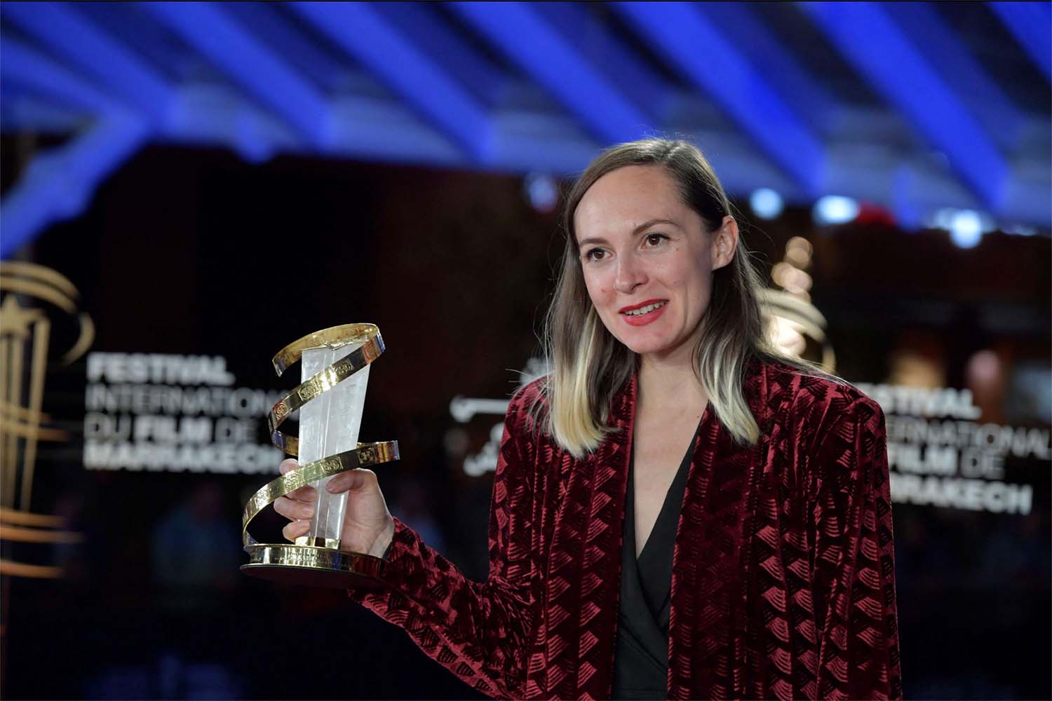 Swiss director and screenwriter Carmen Jaquier poses with her Best Direction Award award