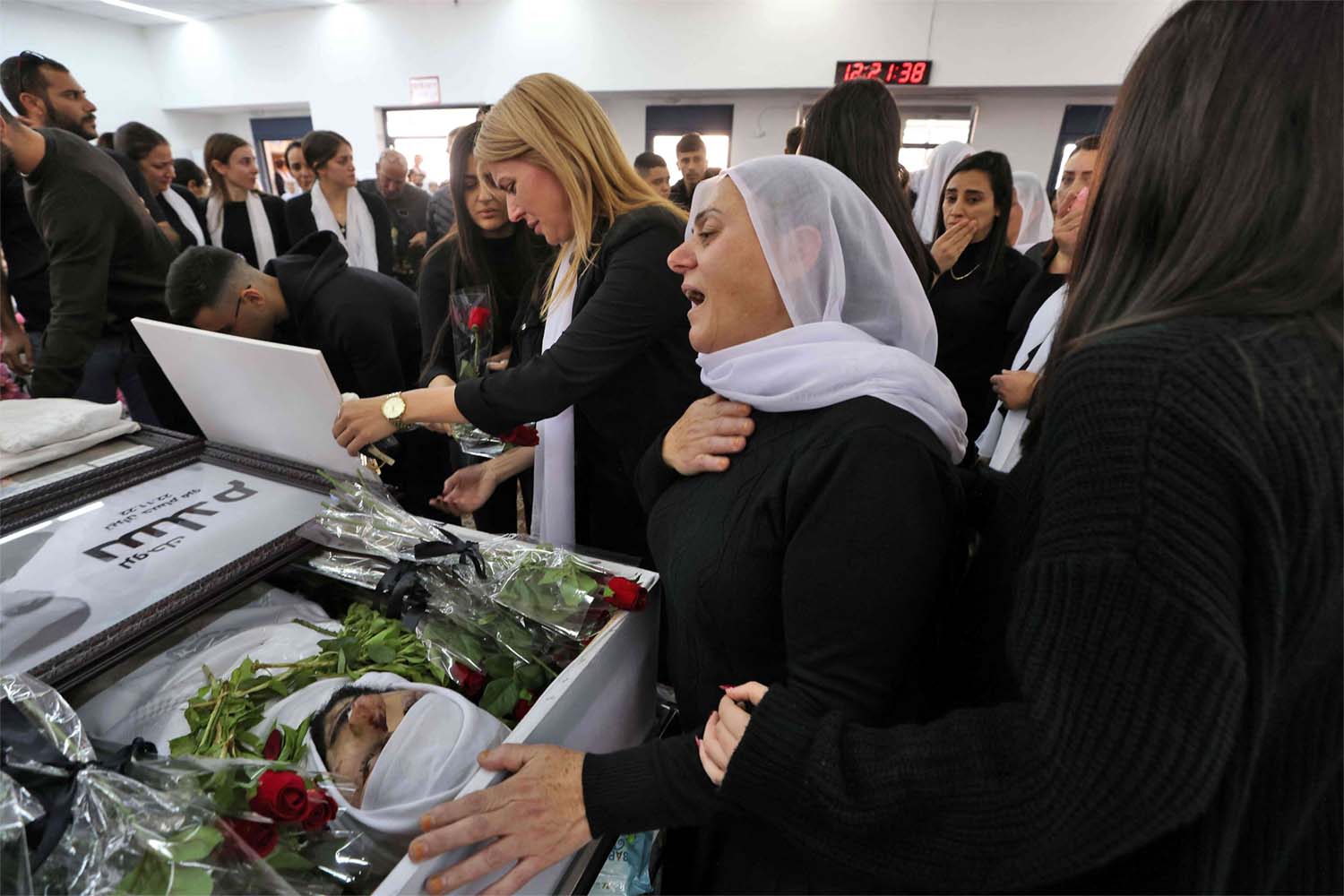 Members of the Israeli Druze minority attend the funeral of 17-year-old Tiran Fero
