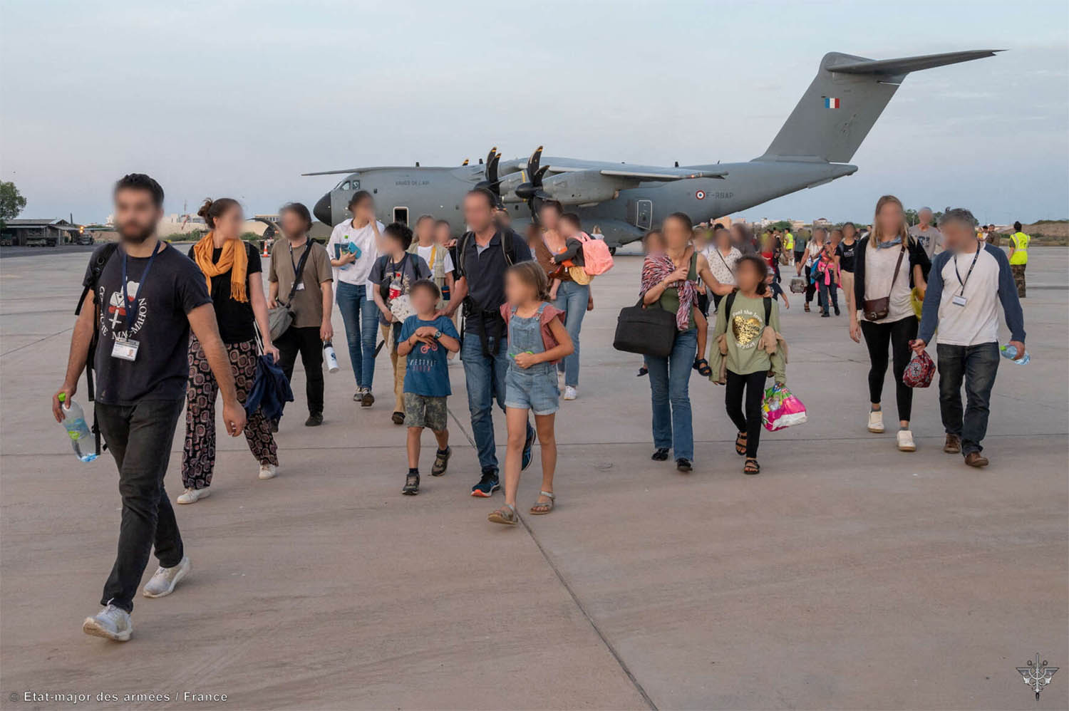 French citizens arrive at the air base of the French Army forces stationed in Djibouti after being evacuated from Sudan 