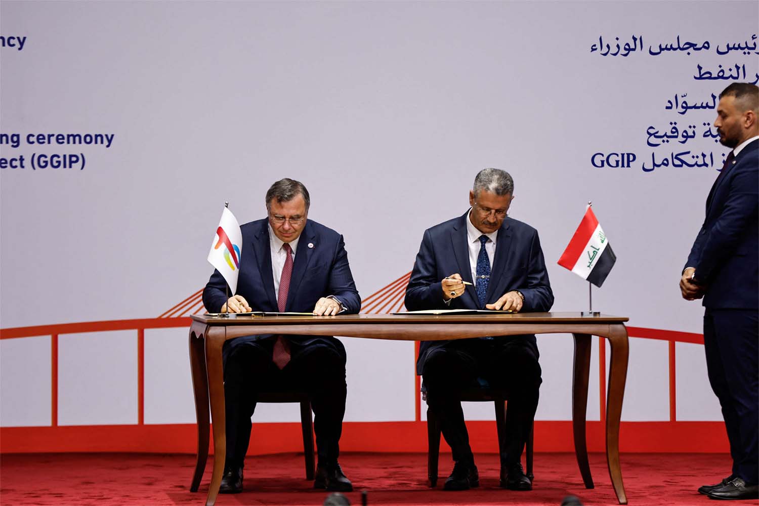 Iraqi Deputy Prime Minister for Energy Affairs and Minister of Oil, Hayan Abdul Ghani Al-Swad and Patrick Pouyanne, Chairman and CEO of TotalEnergies