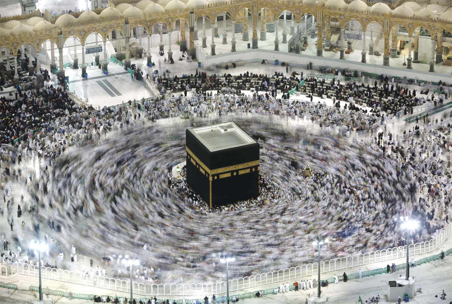 Muslim pilgrims circumambulate the Kaaba, the cubic building at the Grand Mosque, in the Muslim holy city of Mecca