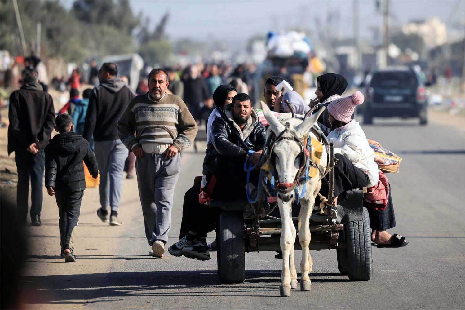 Palestinian families fleeing Khan Younis on the coastal road leading to Rafah