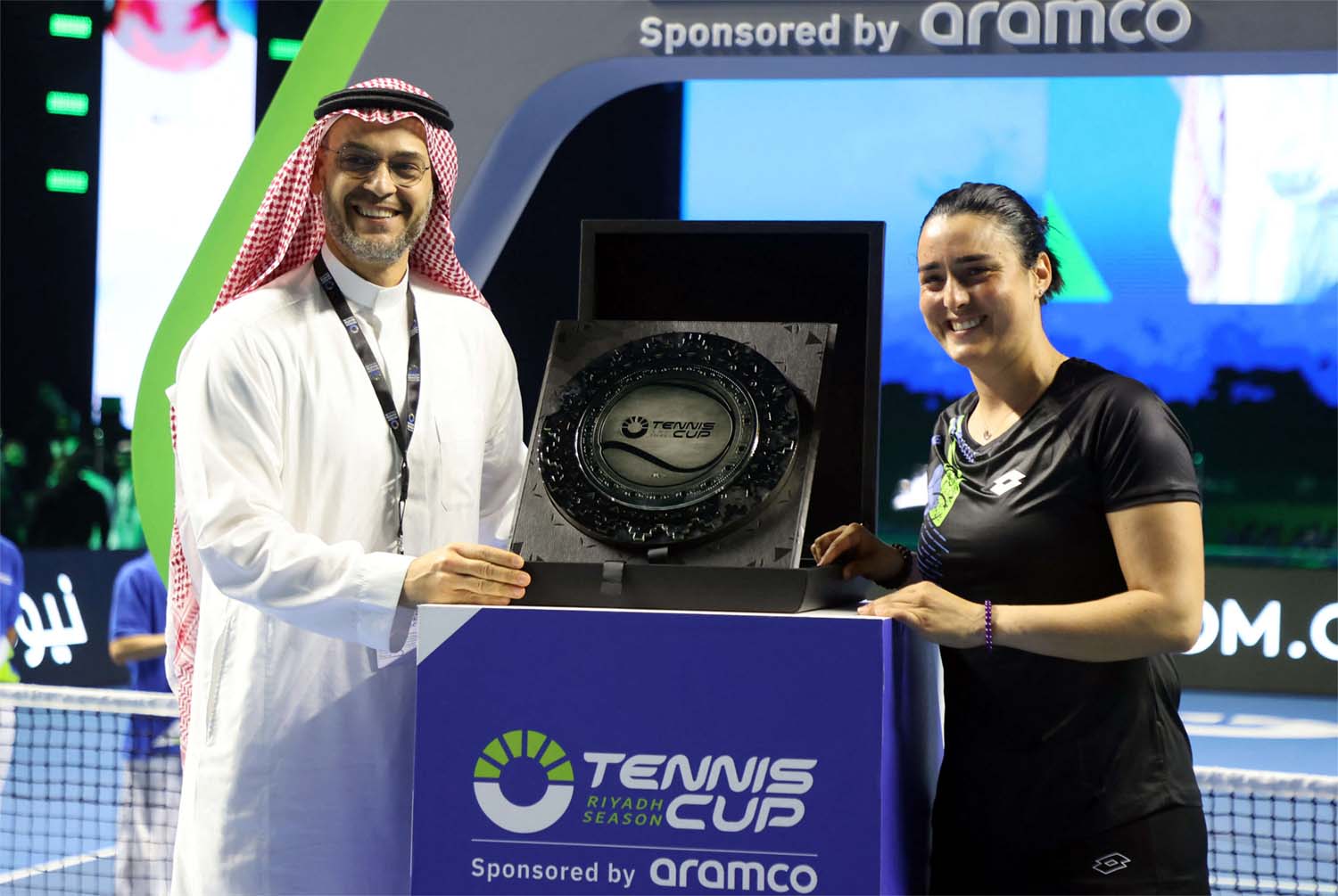 Ons Jabeur receiving a trophy in last month’s exhibition match in Riyadh