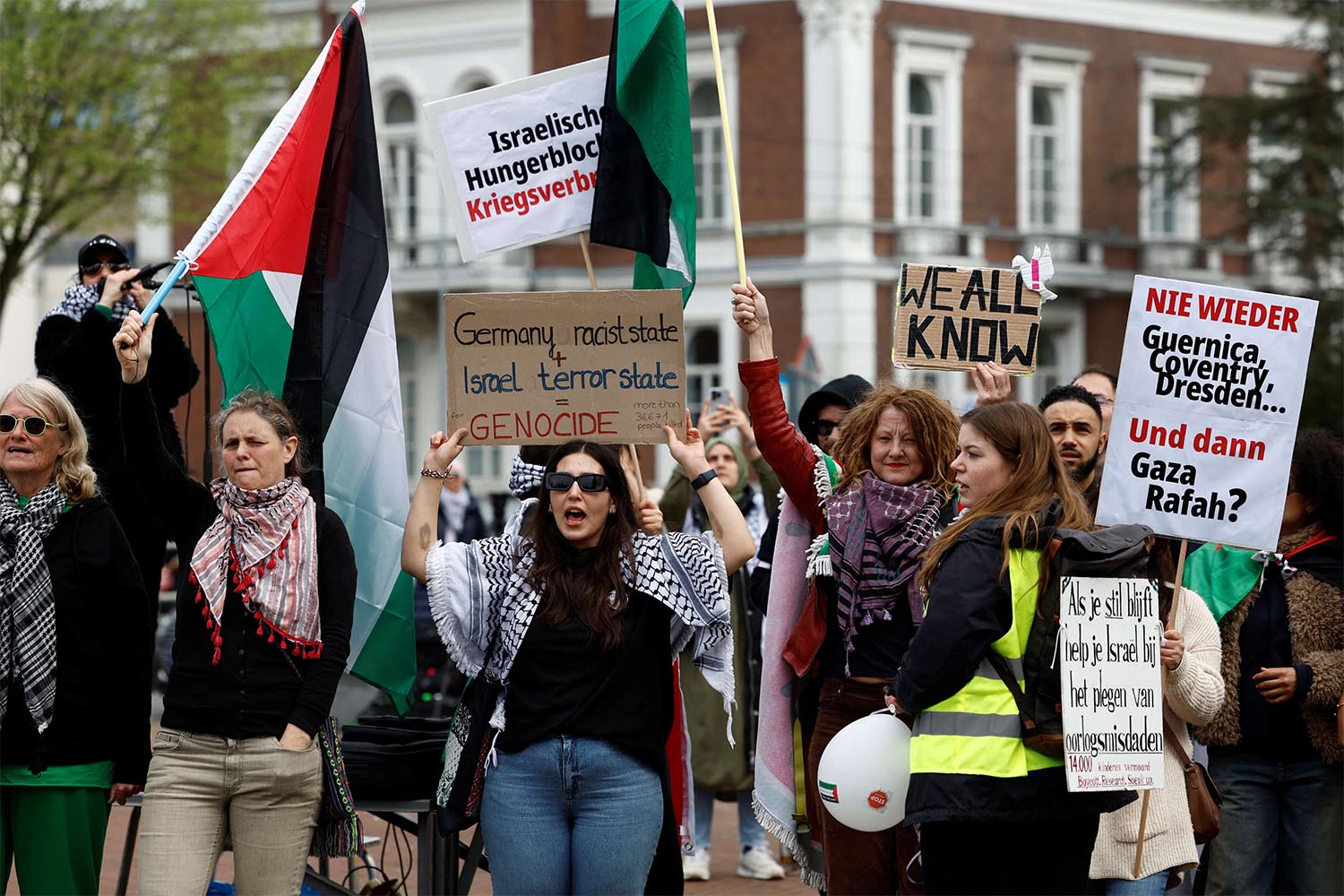 People demonstrate in support of Palestinians outside the ICJ