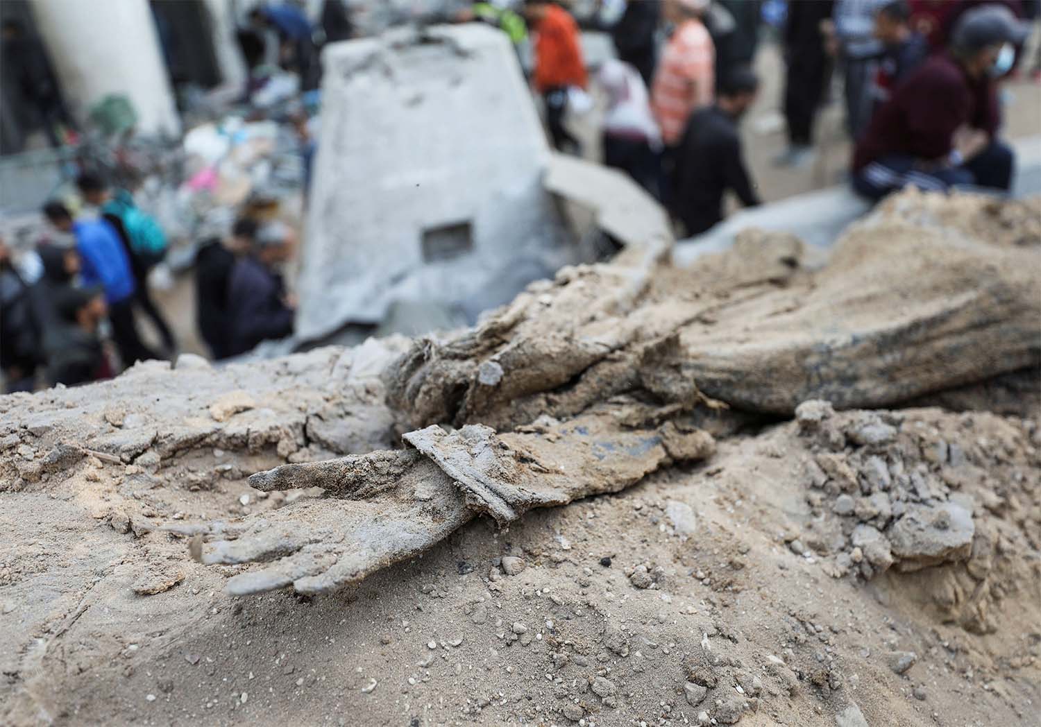 A decomposed body lies on the ground at Al Shifa Hospital after Israeli forces withdrew from the hospital