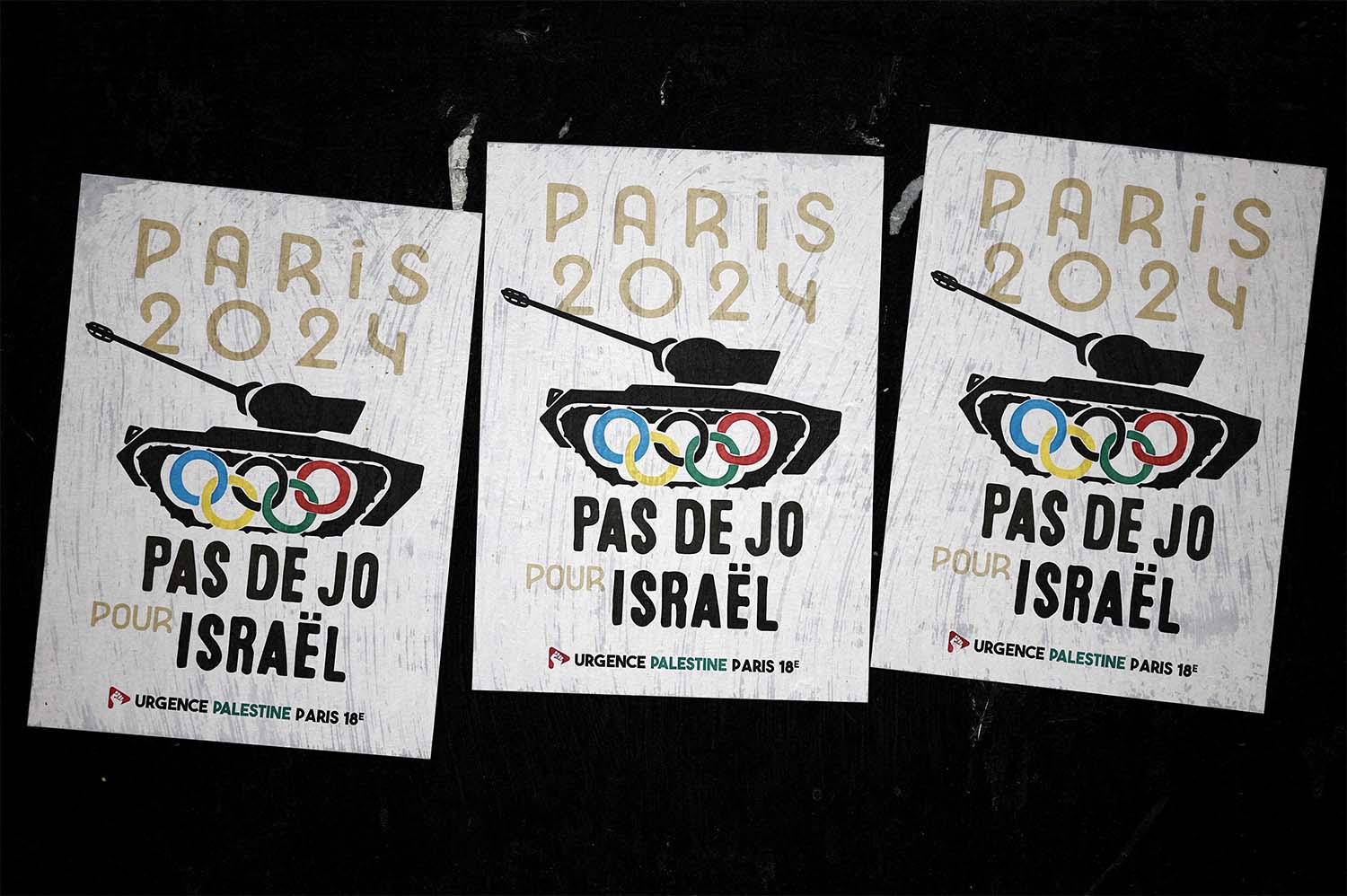 Posters saying No Olympics for Israel are pictured in the 18th arrondissement district in Paris