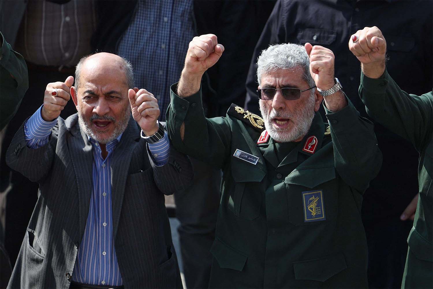 Qaani (R) gestures during the funeral ceremony for slain Guards commander Abbas Nilforoushan in Tehran