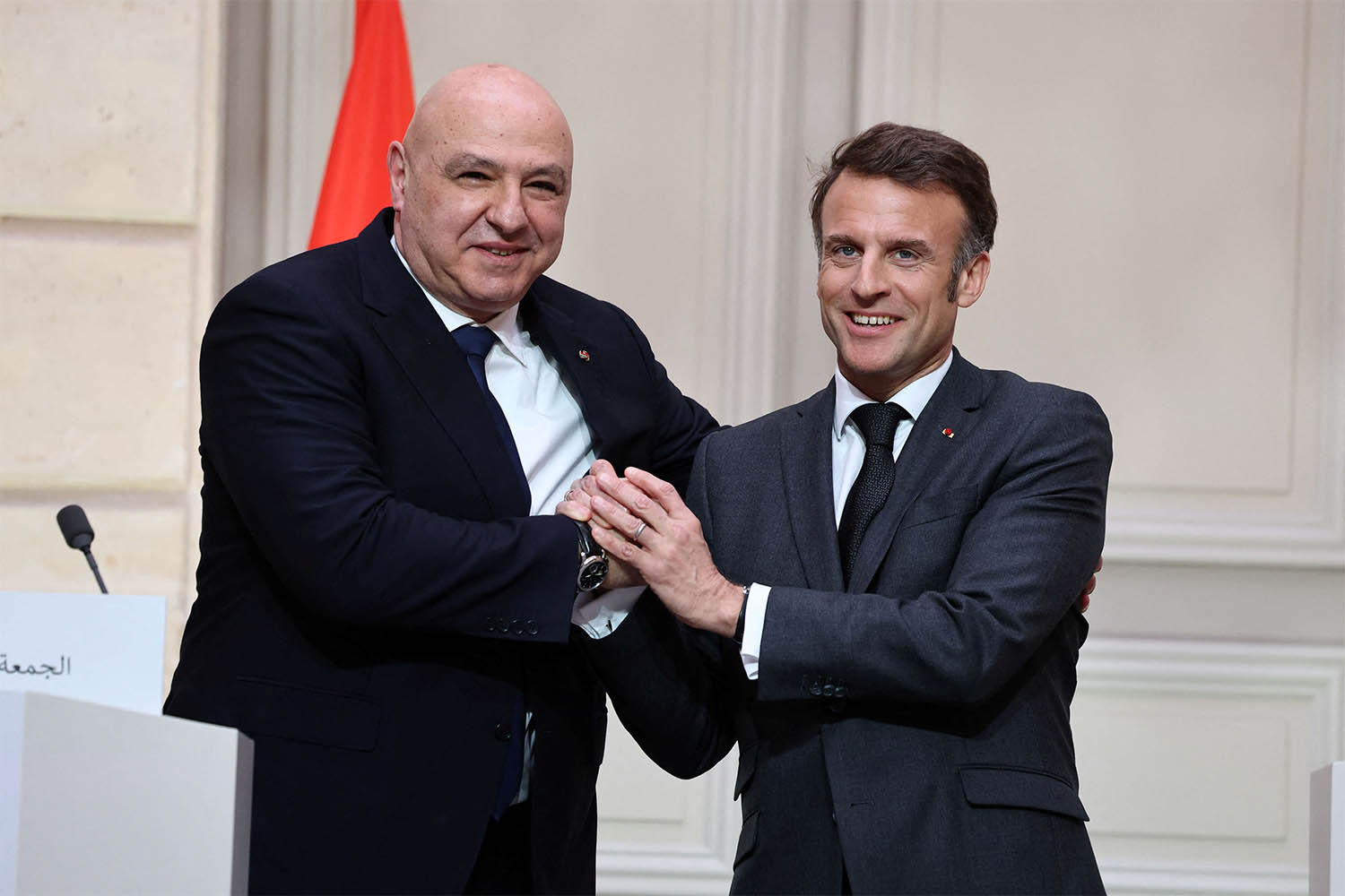 French President Emmanuel Macron and Lebanese President Joseph Aoun shake hands during a joint press conference