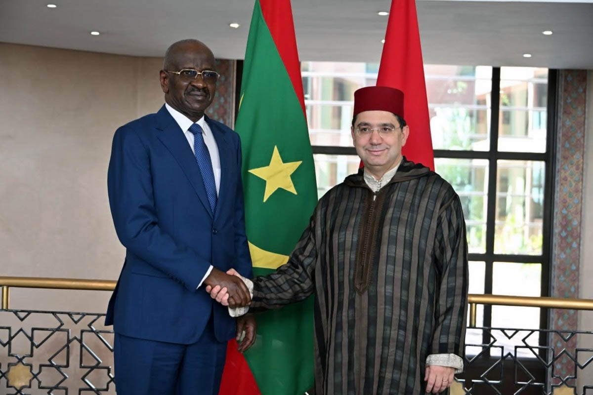 Ould Merzoug shaking hands with Bourita at Morocco's foreign ministry