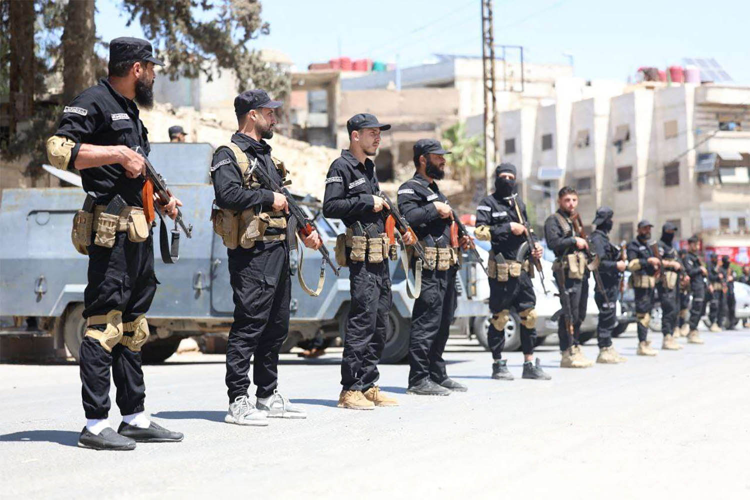 yria's security forces standing guard in a street in the mostly Druze and Christian Jaramana suburb of Damascus