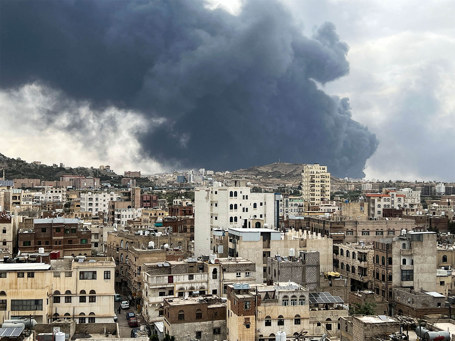 Smoke billows after an Israeli airstrike on Houthi infrastructure, in Sanaa