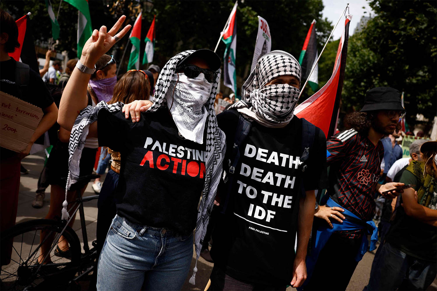 Palestine Action activists gathering outside the High Court in London 