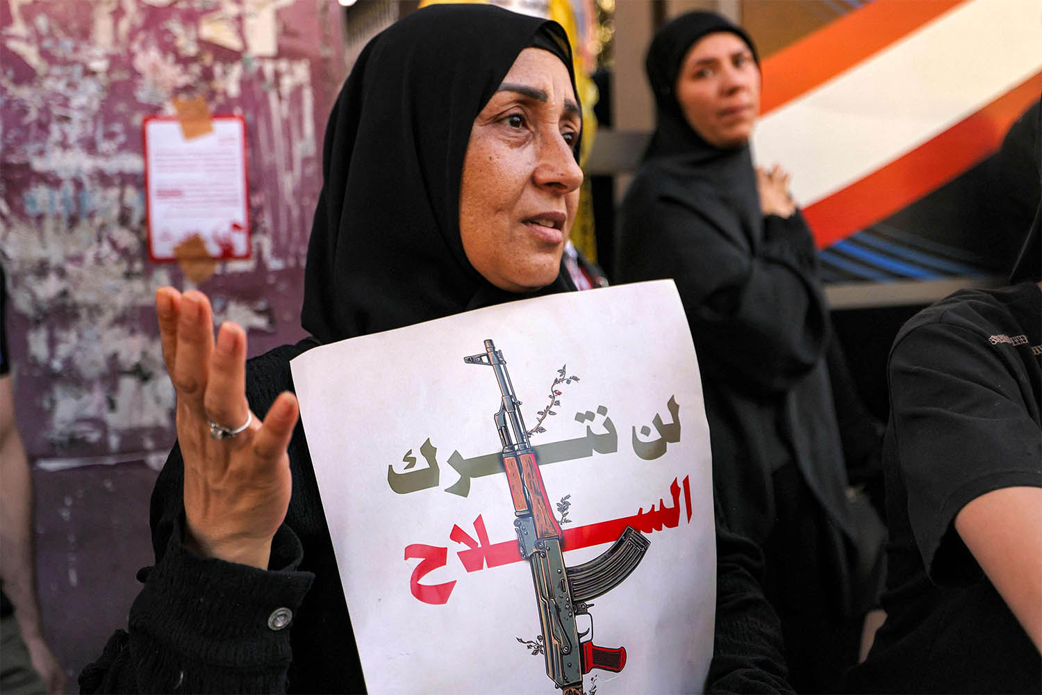 We will relinquish arms, reads the banner