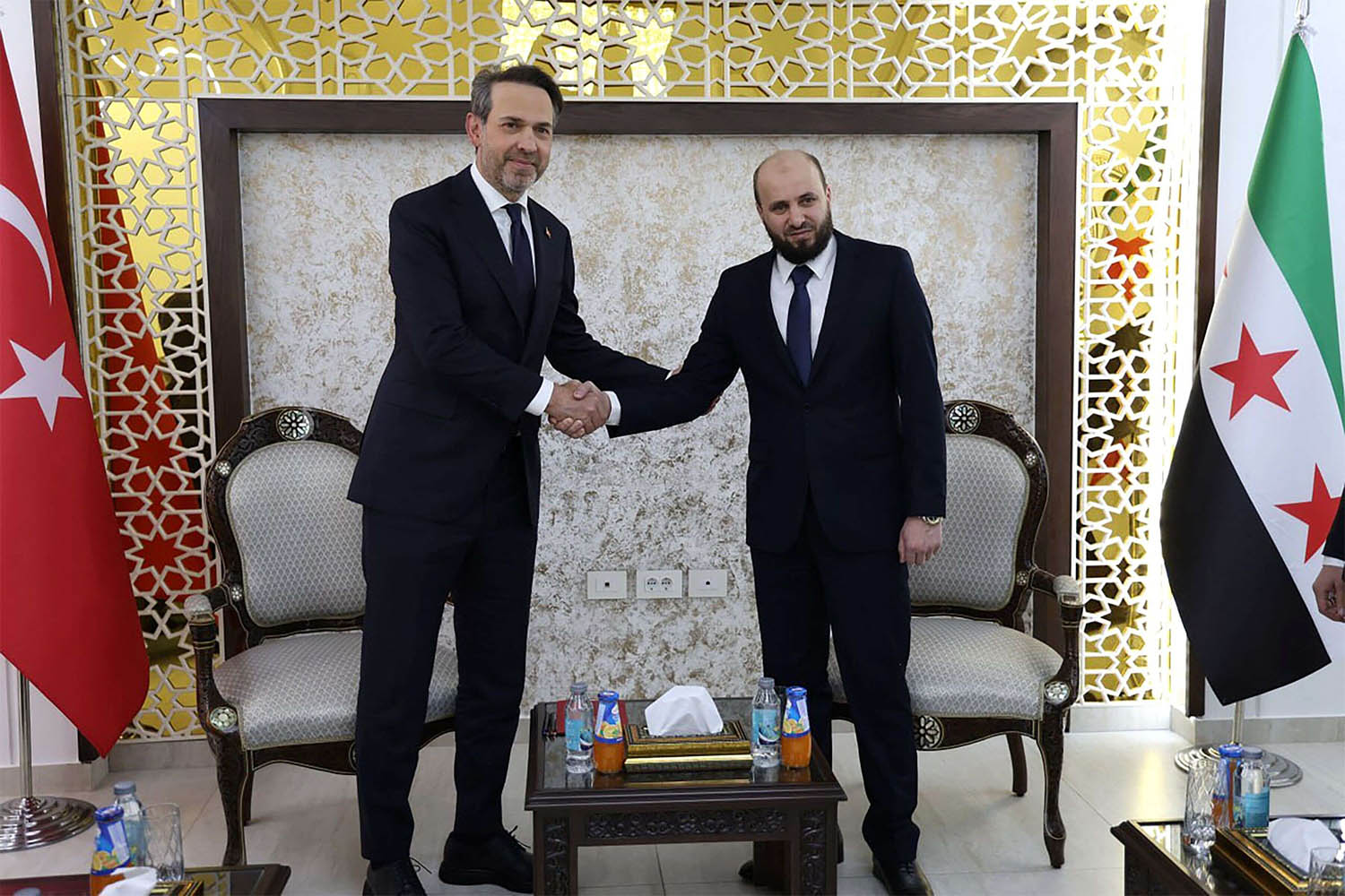 Syria's Minister of Energy Mohammed al-Bashir (R) receiving Turkish Minister of Energy Alparslan Bayraktar in Damascus on May 22