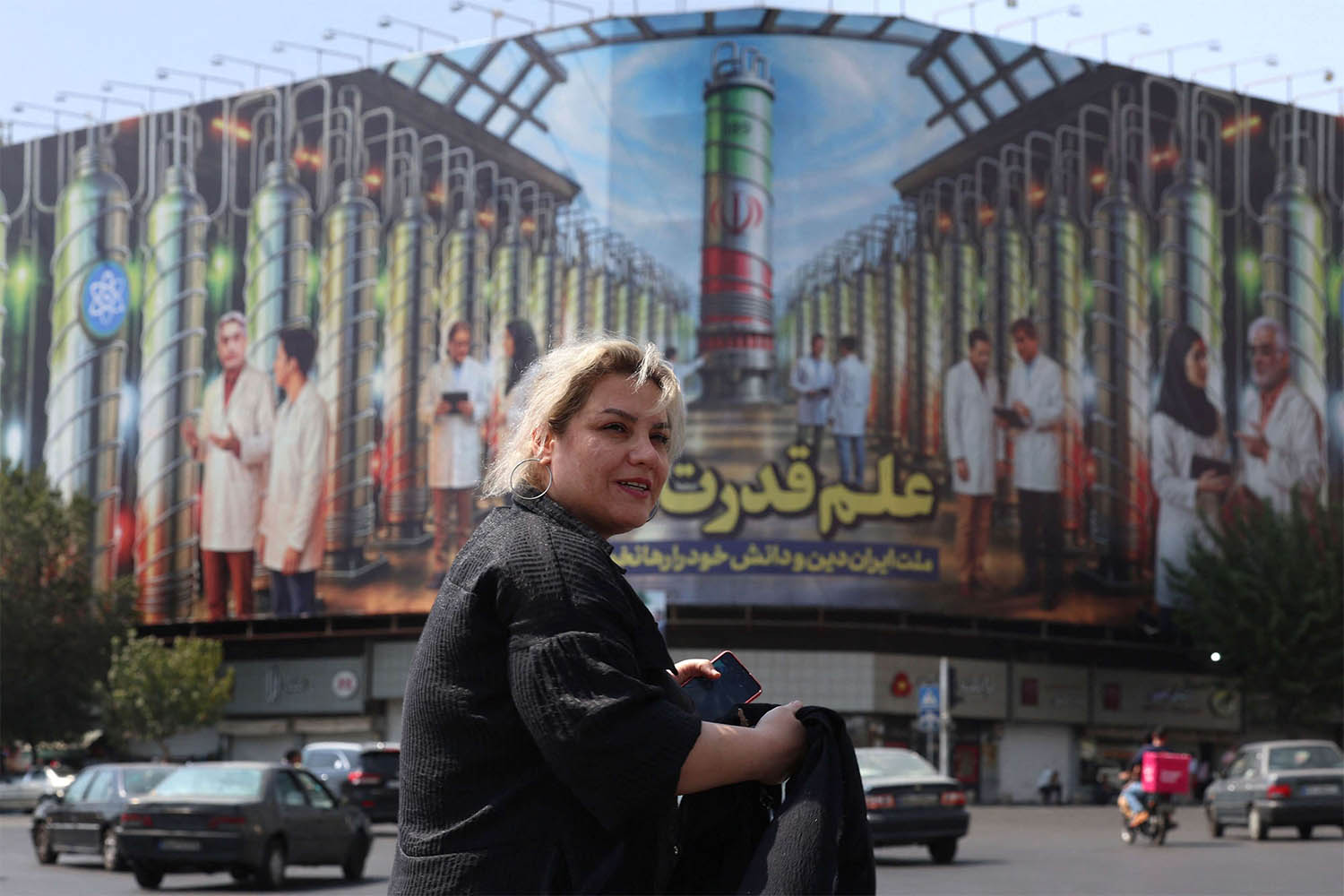 A billboard displaying in Tehran pictures of nuclear scientists, centrifuges and a sentence reading in Farsi: Science is the power