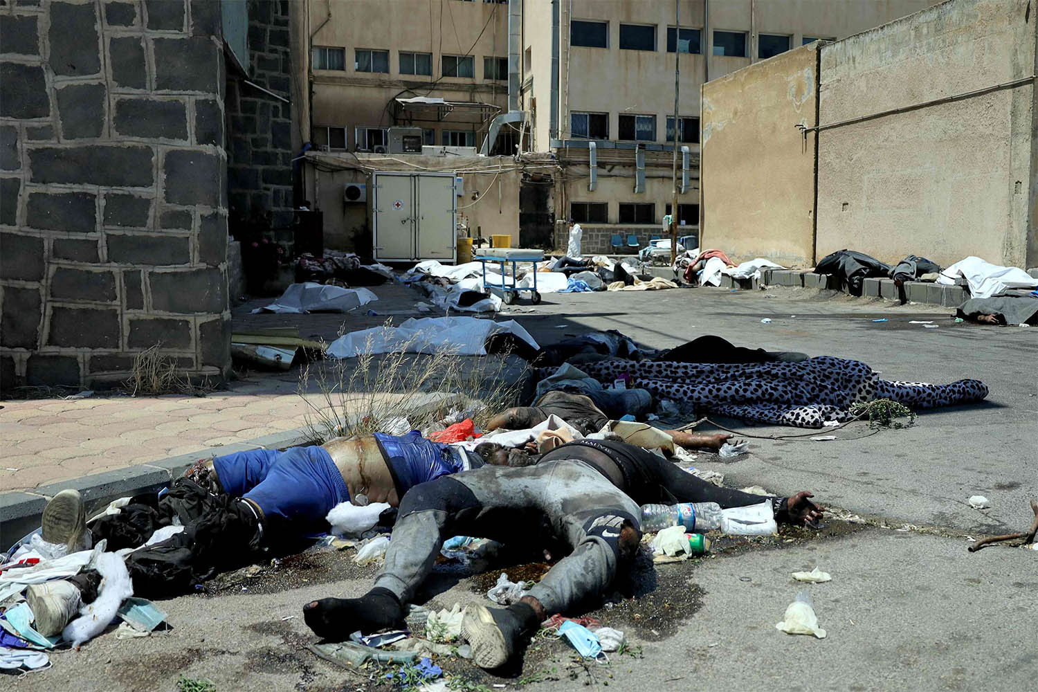 Bodies of people killed during sectarian violence lie outside Sweida National Hospital