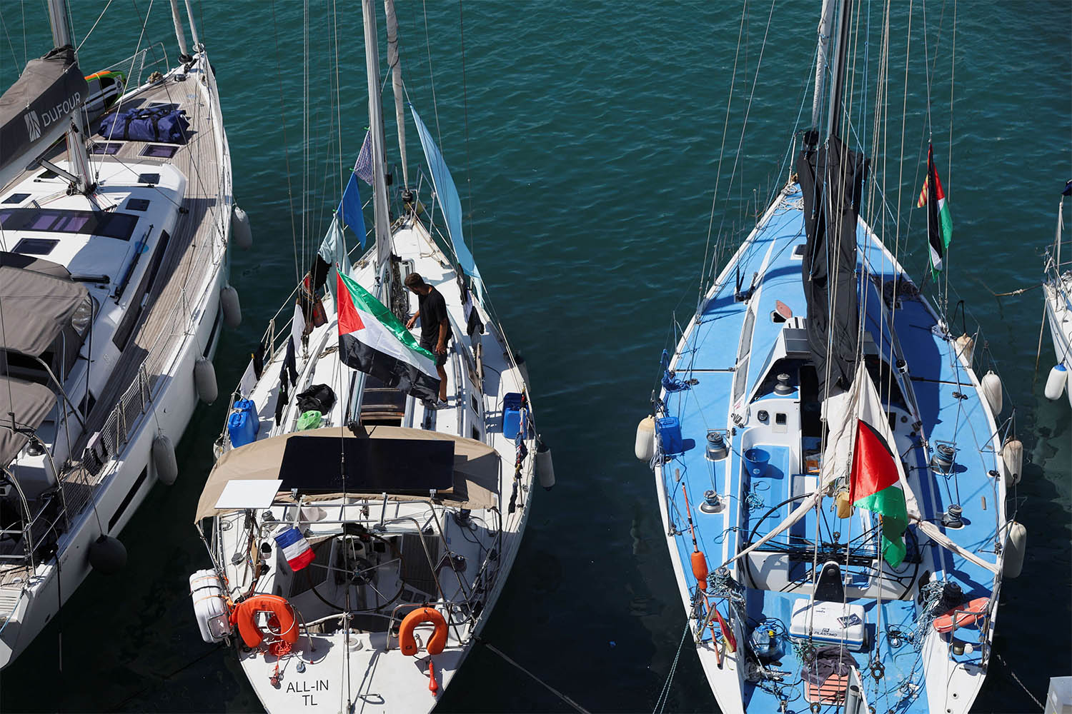Boats of a humanitarian flotilla with aid and pro-Palestinian activists in Barcelona
