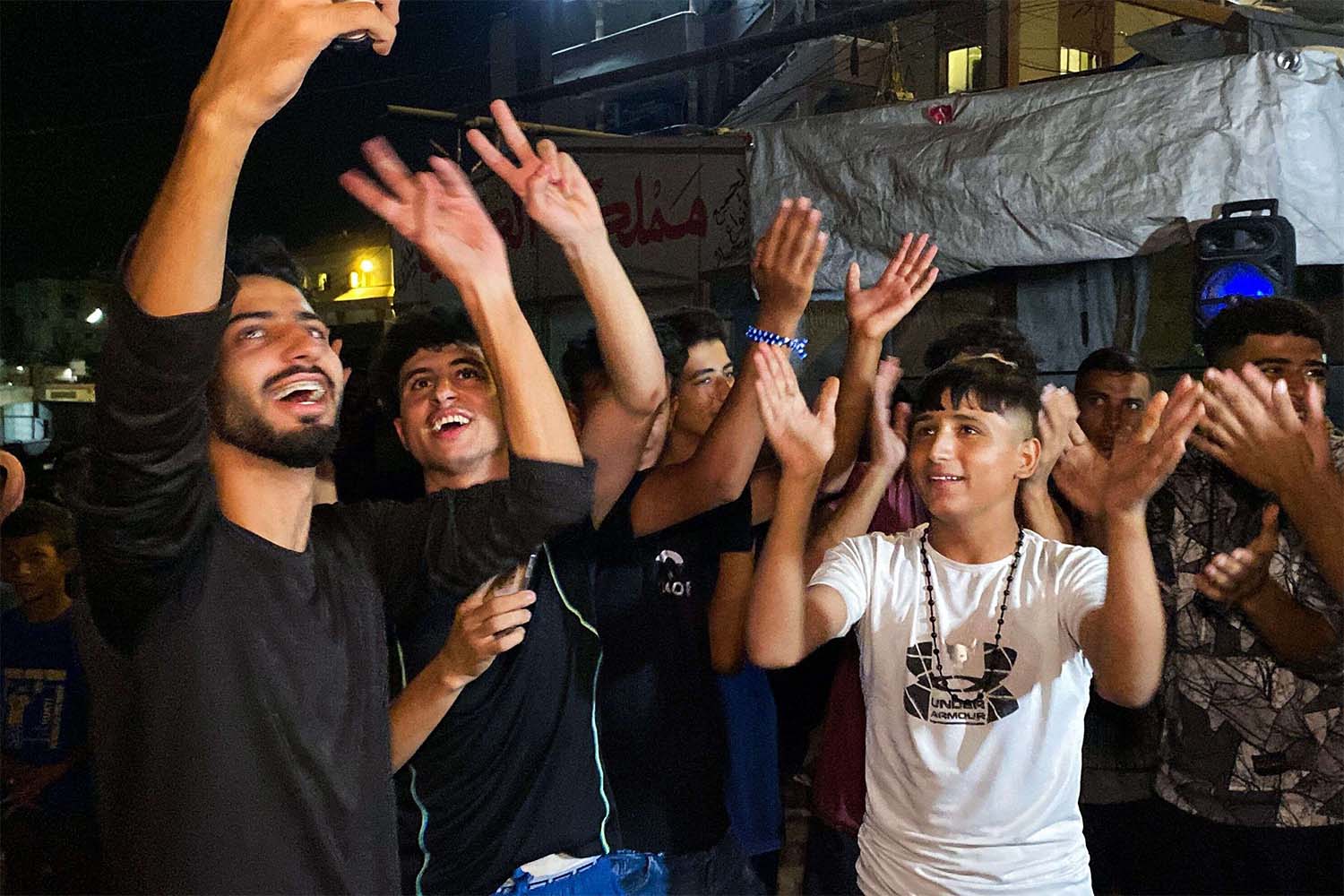 Gazans celebrate the ceasefire announcement