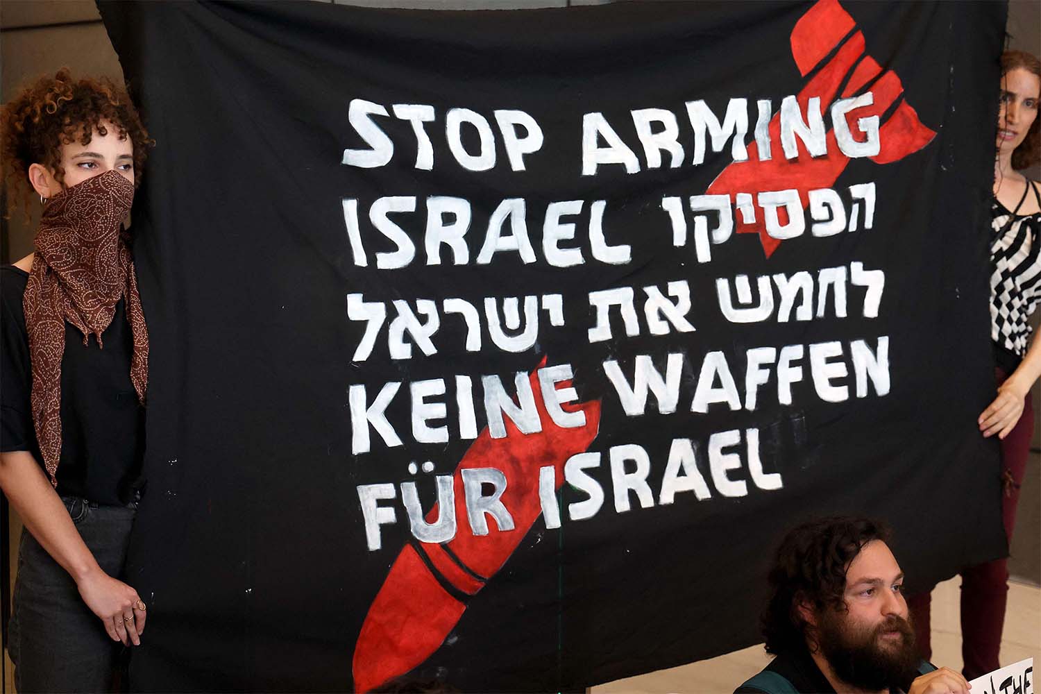 German and Israeli activists block the entrance to the German embassy in Tel Aviv during a protest calling on Germany to stop arming Israel last year