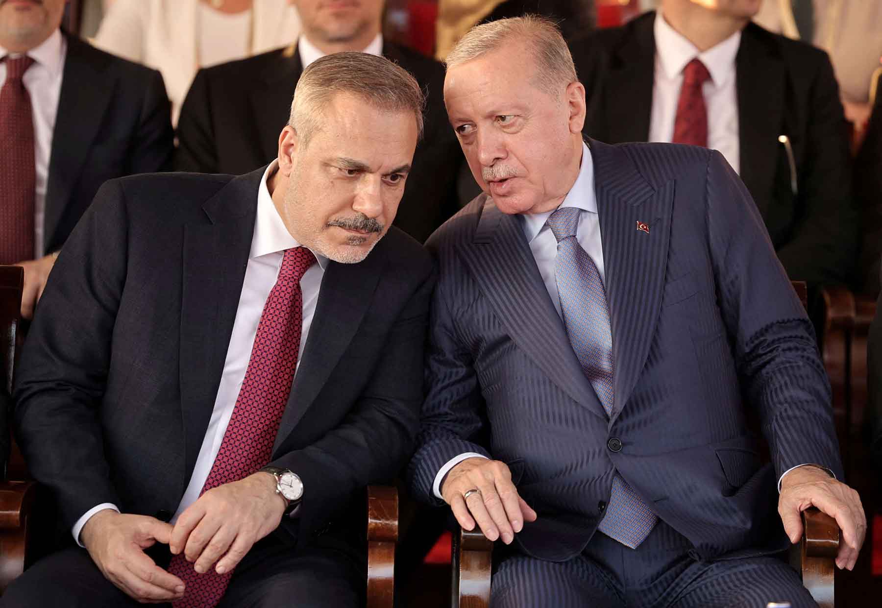 Turkish President Recep Tayyip Erdogan and Turkish Foreign Minister Hakan Fidan attend a military parade in the Turkish-controlled northern Cyprus, in the divided city of Nicosia, July 20, 2025. 