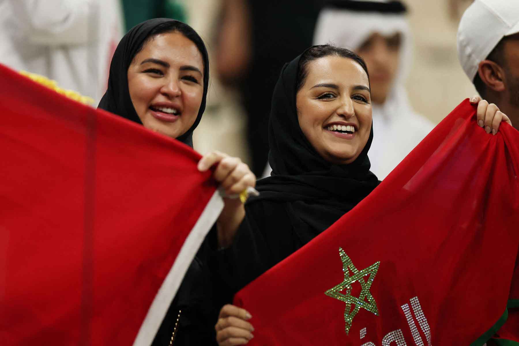 Morocco fans raise the national flag at the Lusail Stadium in Qatar.